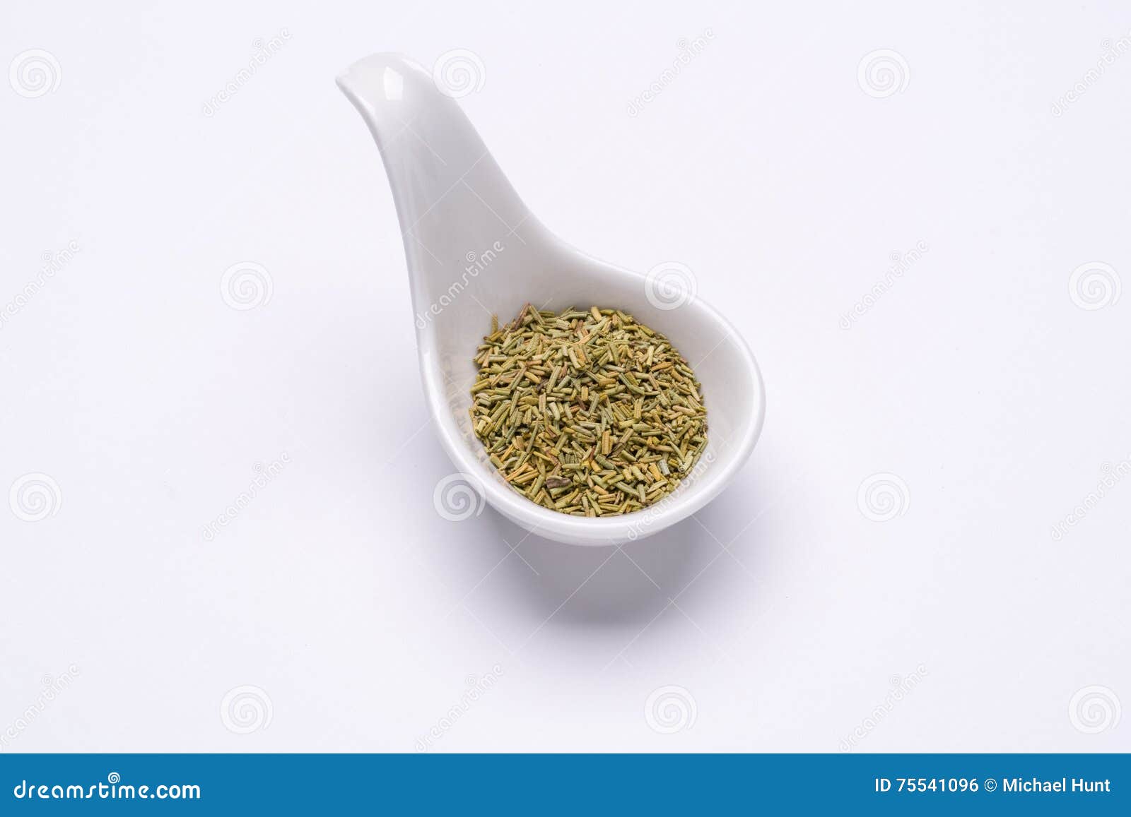 Monotone Crushed Rosemary 1 Tablespoon in a White Spoon Stock Photo