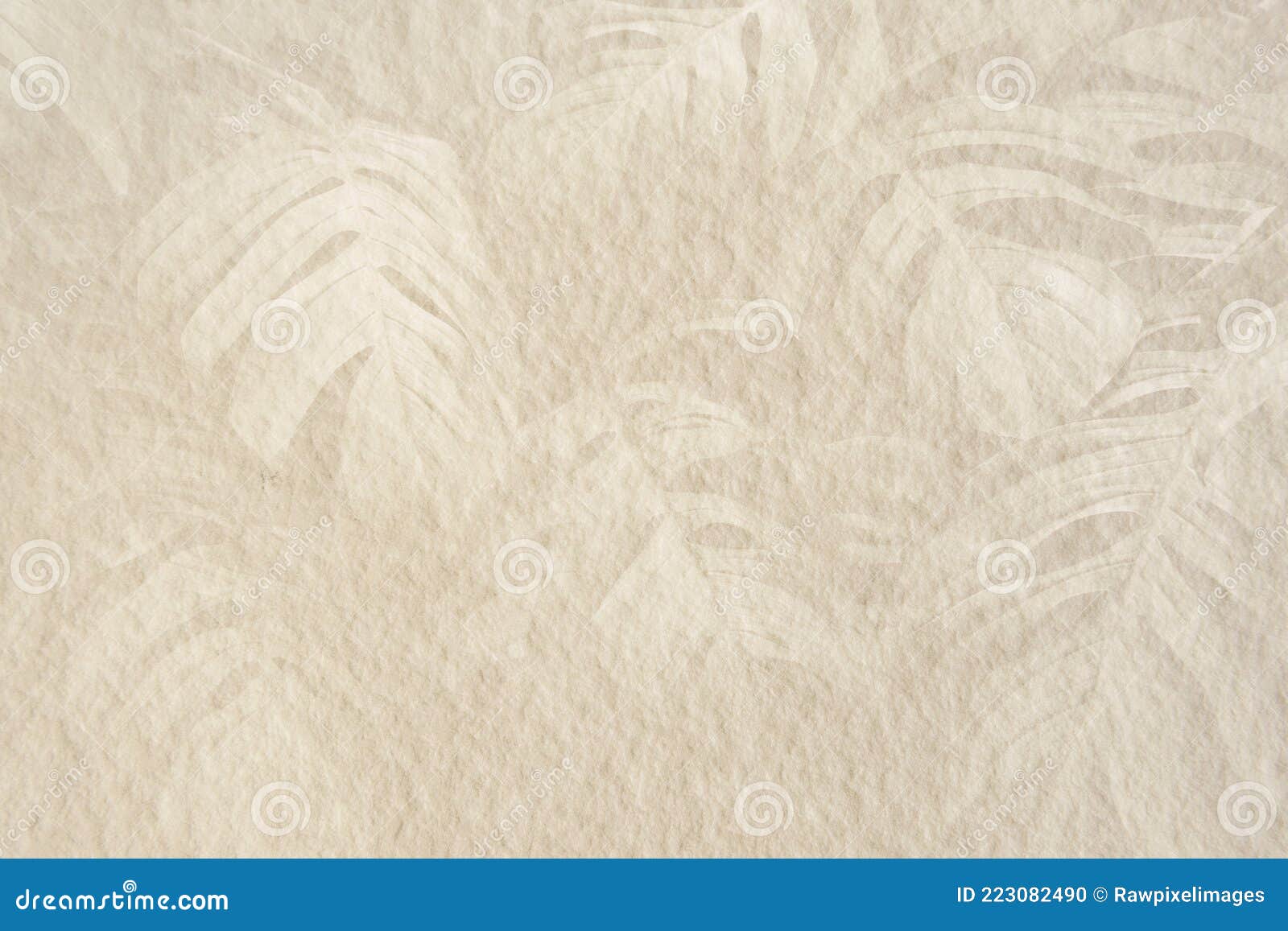 monstera leaf pattern on a beige cement background 