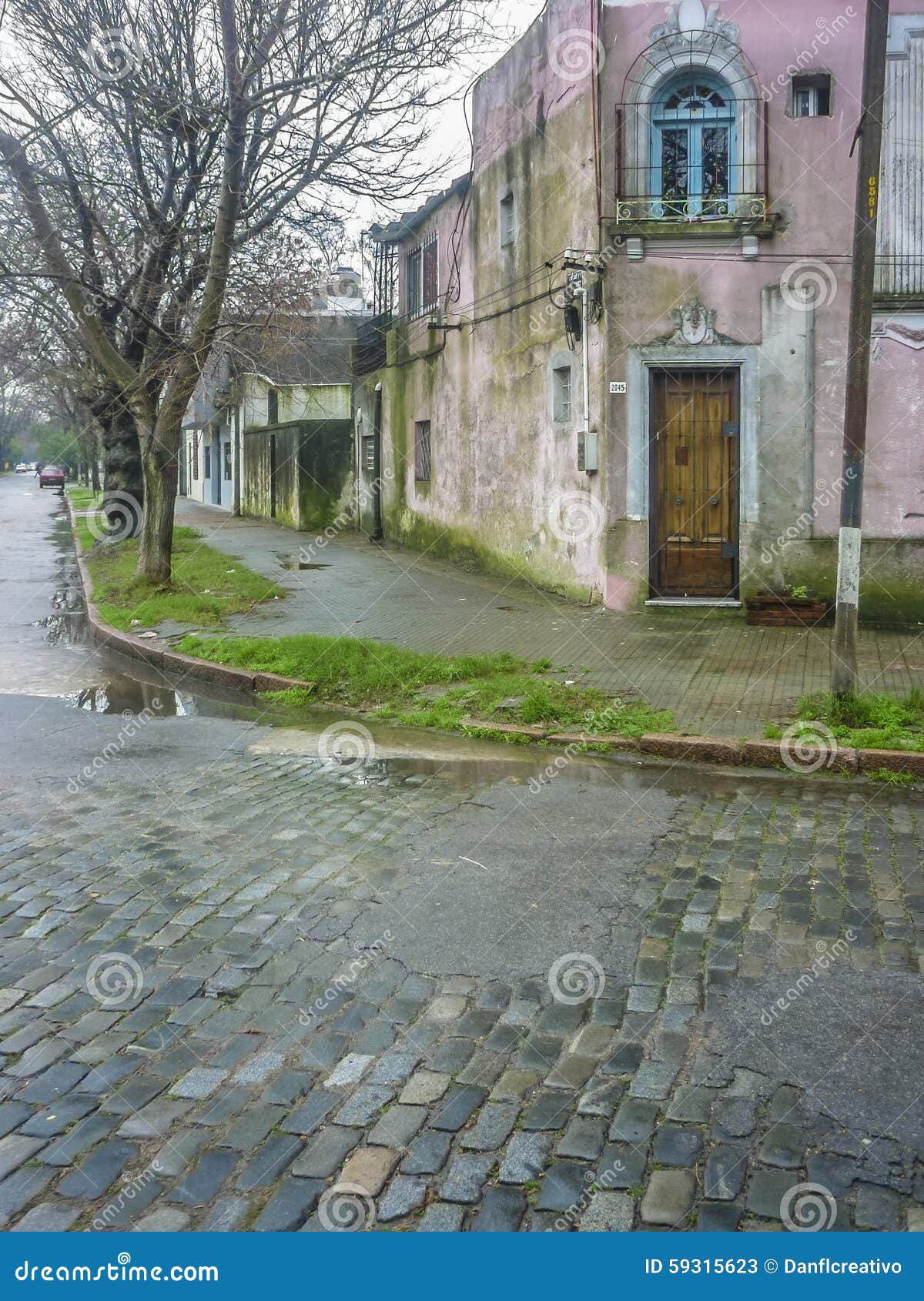 Montevideo Old Style House. Picturesque old house and cobbles street in an ordinary neigbourhood of Montevideo city, the capital of Uruguay