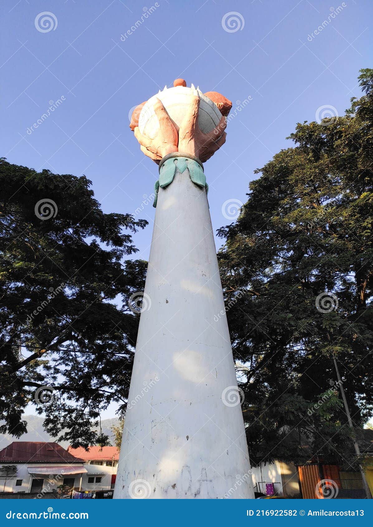 monument of hand holding coconut shoot in dili