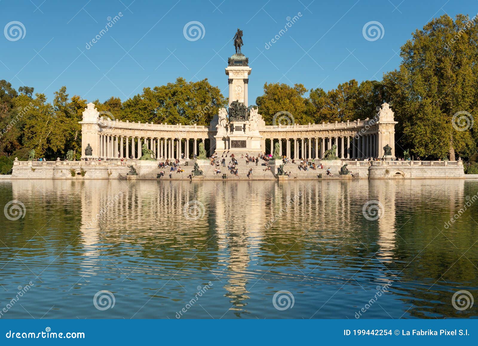 monument to alfonso xii by the pond