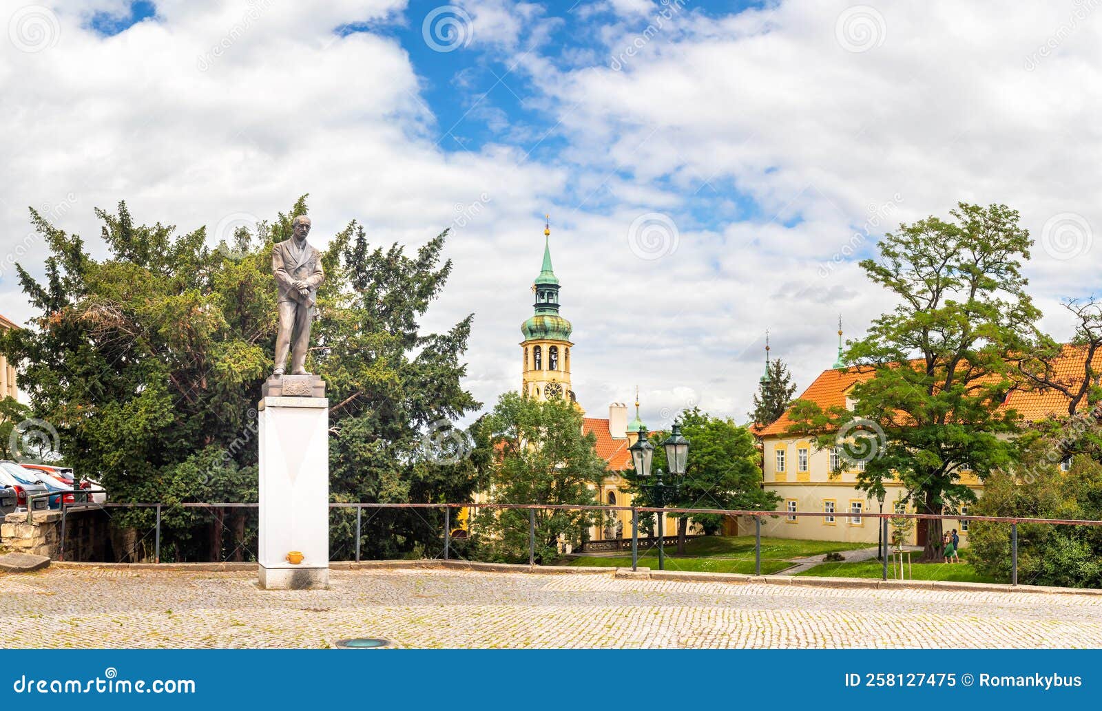statue, monument to edvard benes on loreto square and tower of loreta monastery church, prague, czech republic