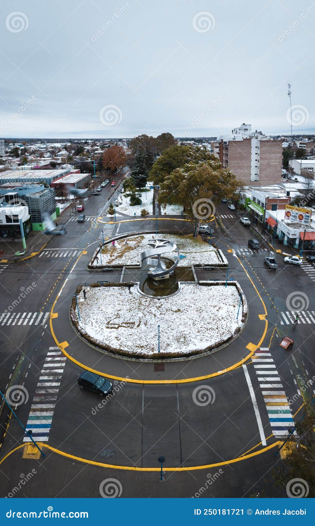 monumento a la manzana during snowfall aerial view. general roca, rio negro, argentina