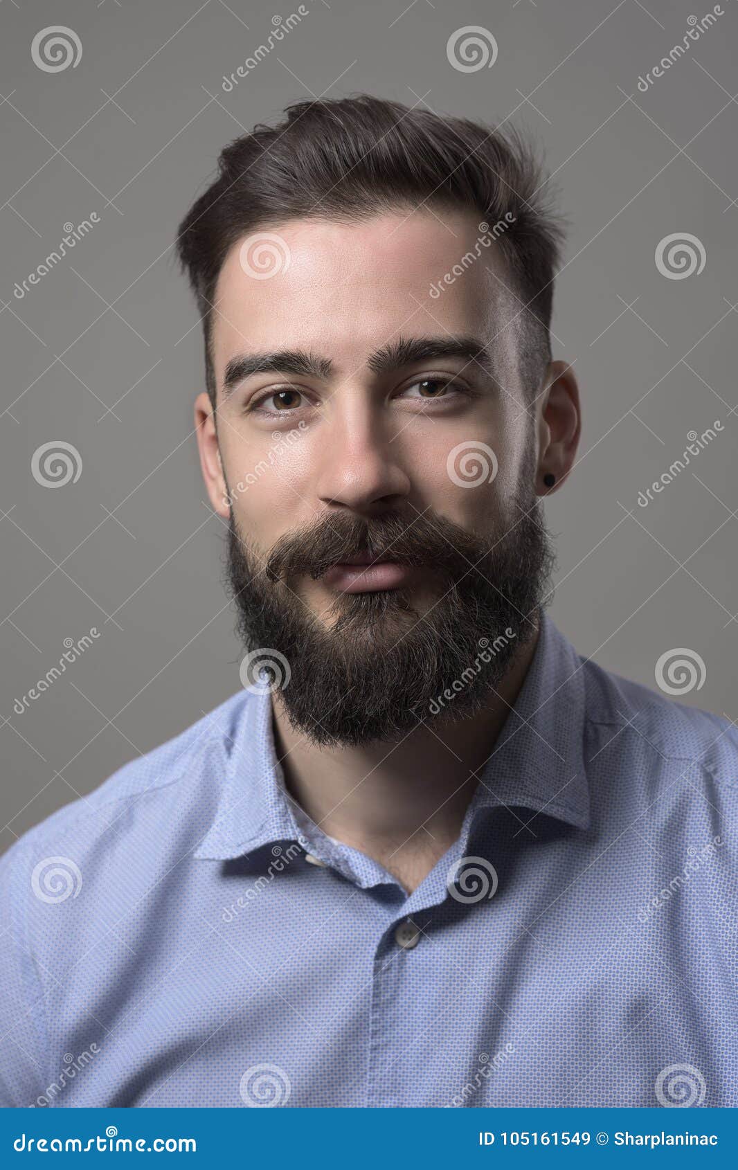 Moody Close Up Portrait Of Young Bearded Man Smiling And Looking At ...