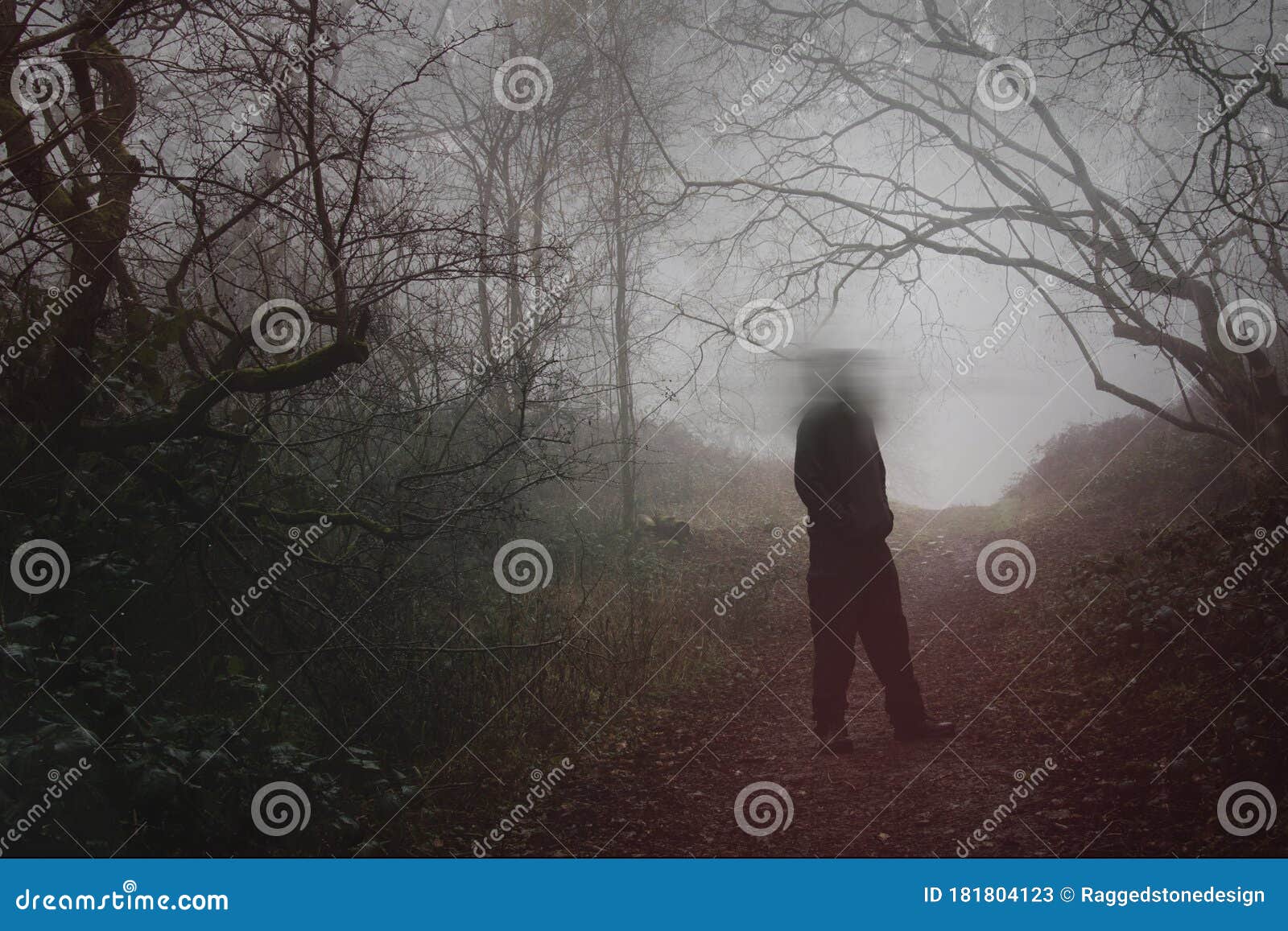 A Moody Figure with a Blurred Head Standing in a Forest on a Foggy ...