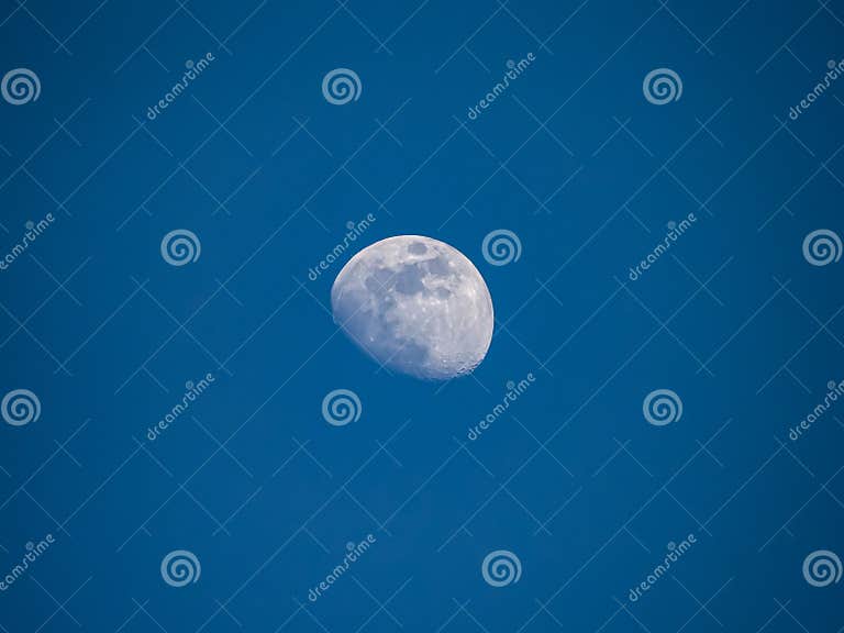 Moon in the afternoon sky stock photo. Image of astronomical - 152551896