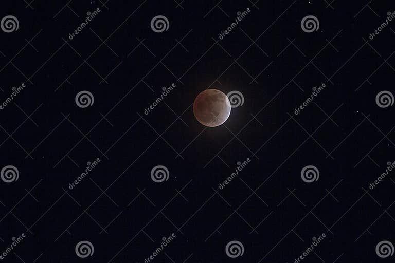 Moon Eclipse in Pakistan Captured with Stars at Night Stock Photo