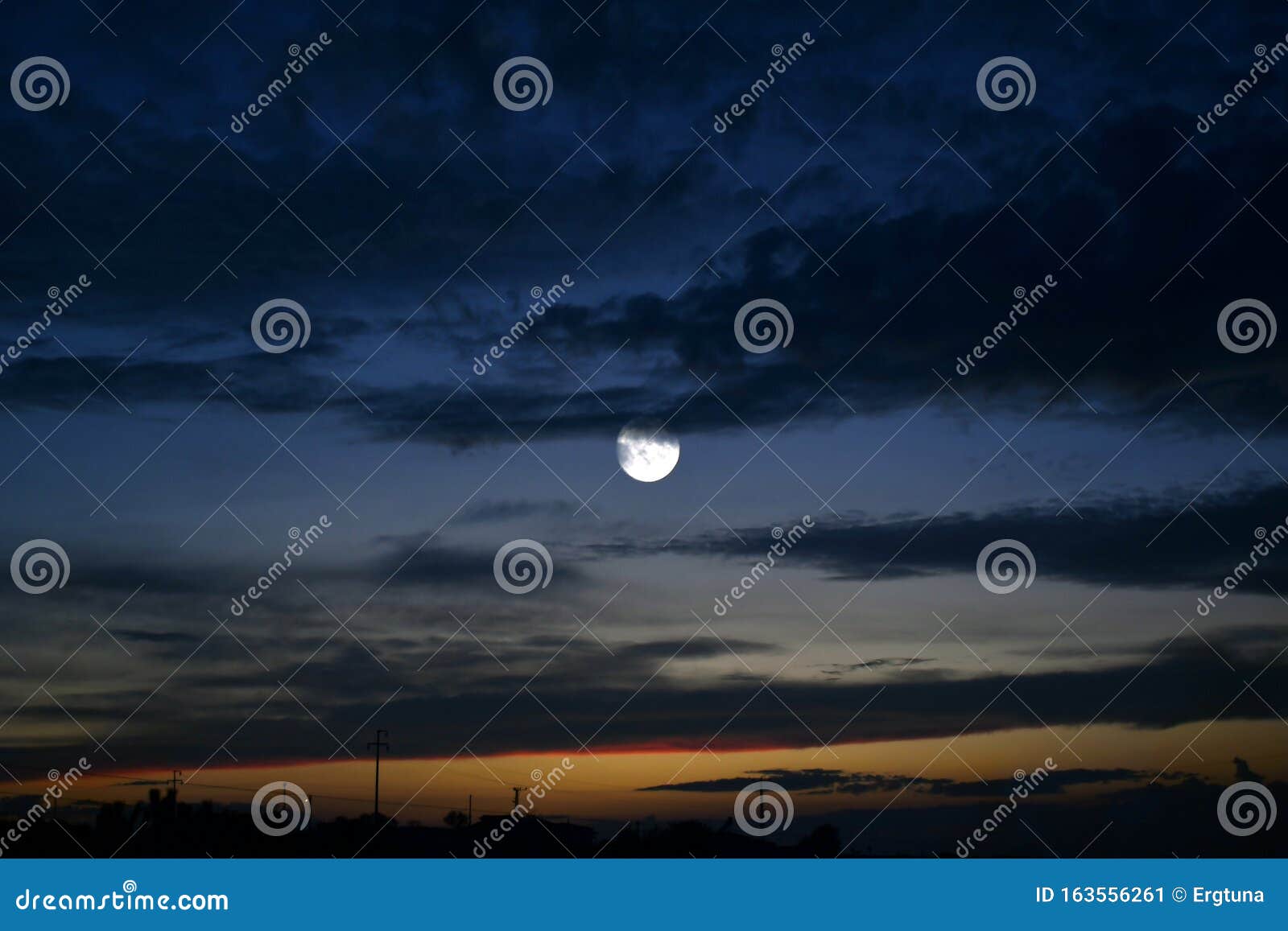 the moon obscured by clouds in the autumn evening sky, Sky with abstract colors, abstract natural background