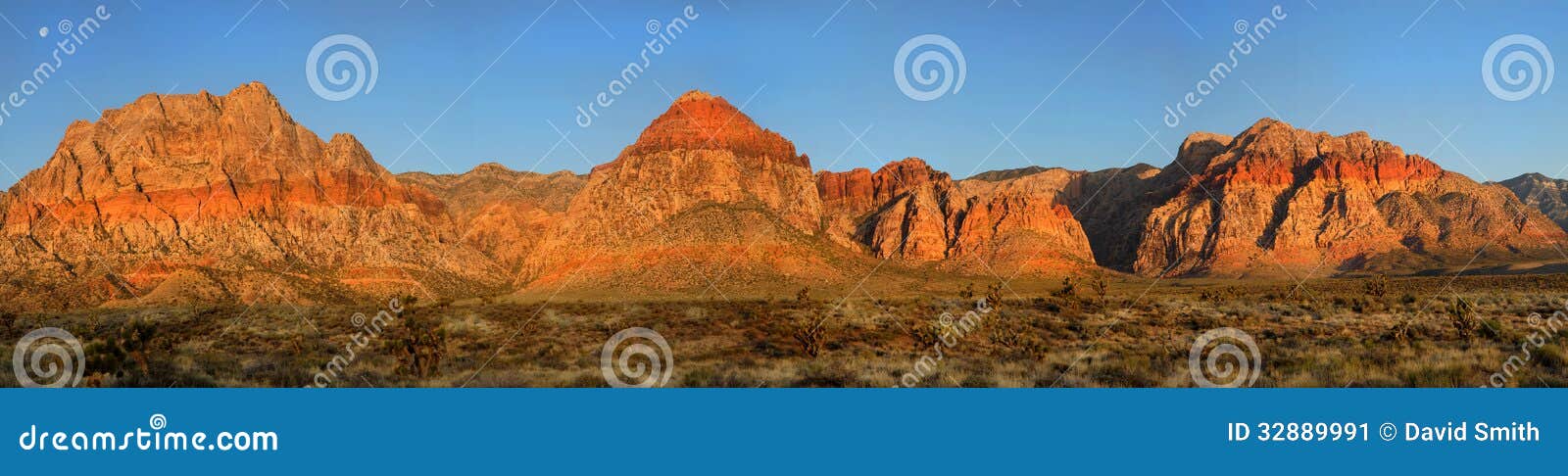 moon over red rock canyon, nevada at sunrise