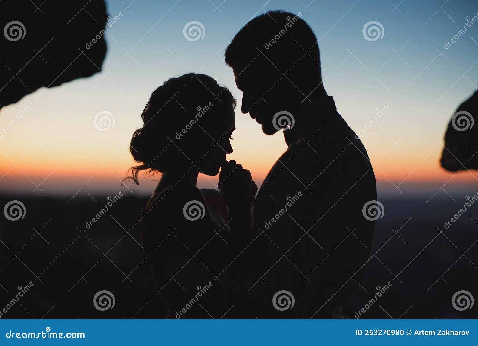 Romantic couple in love embrace in the moonlight Silhouettes of