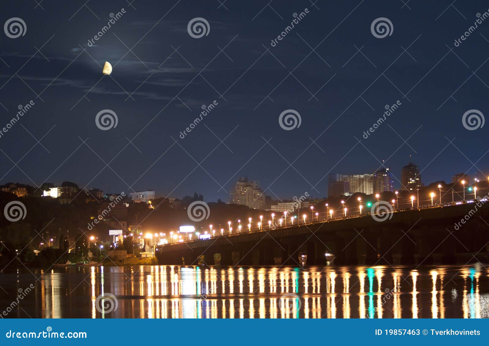 moonset in kiev over dnieper river in lights