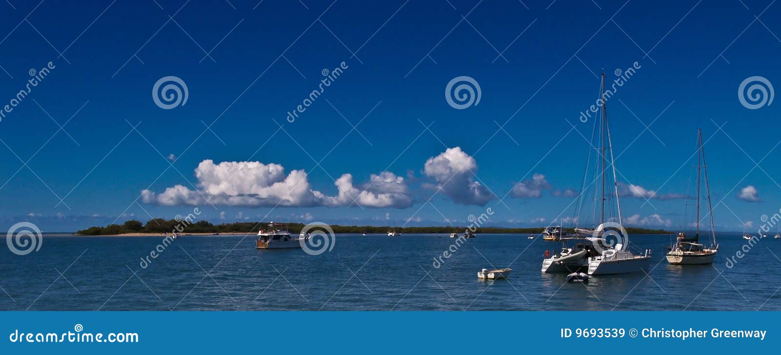 moored boats around island