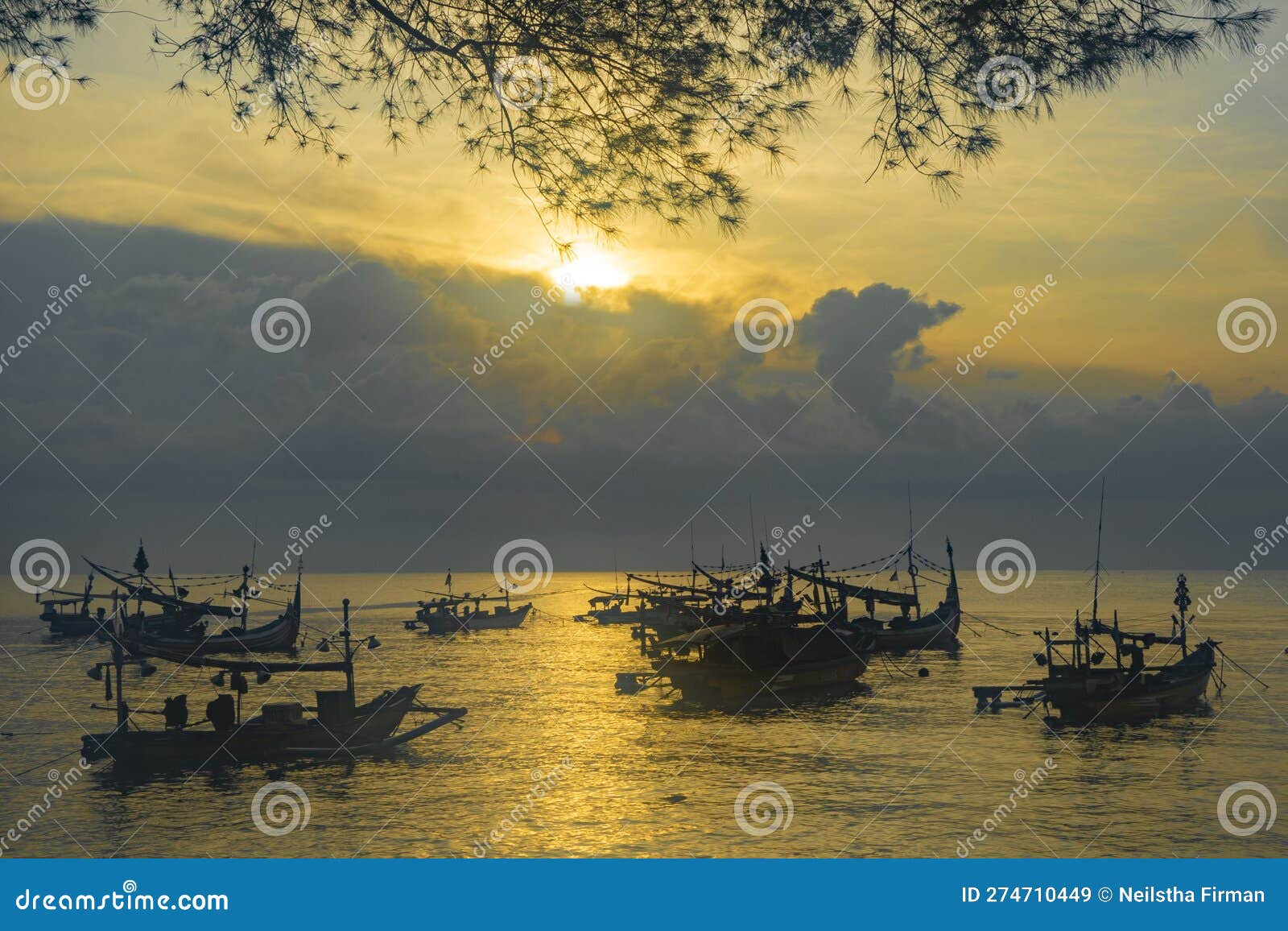 moored boats during sunrise in satelit beach banyuwangi