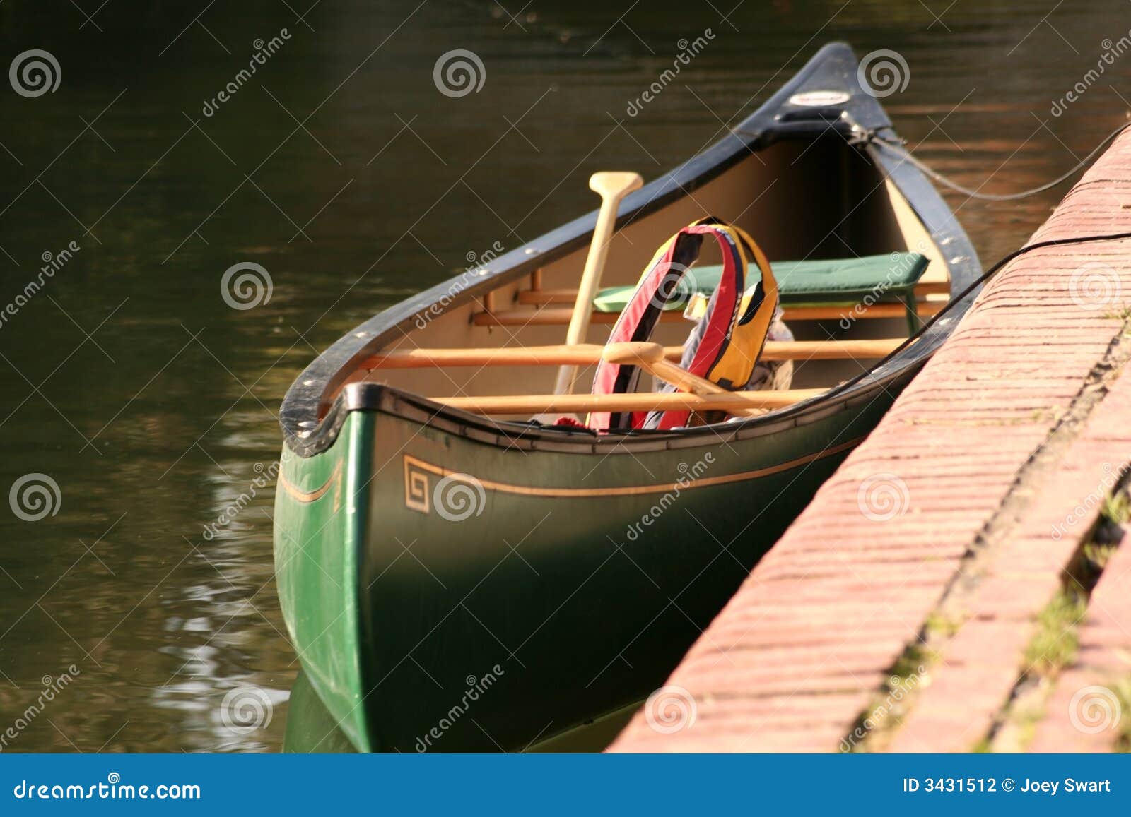 moored canoe and lifevest