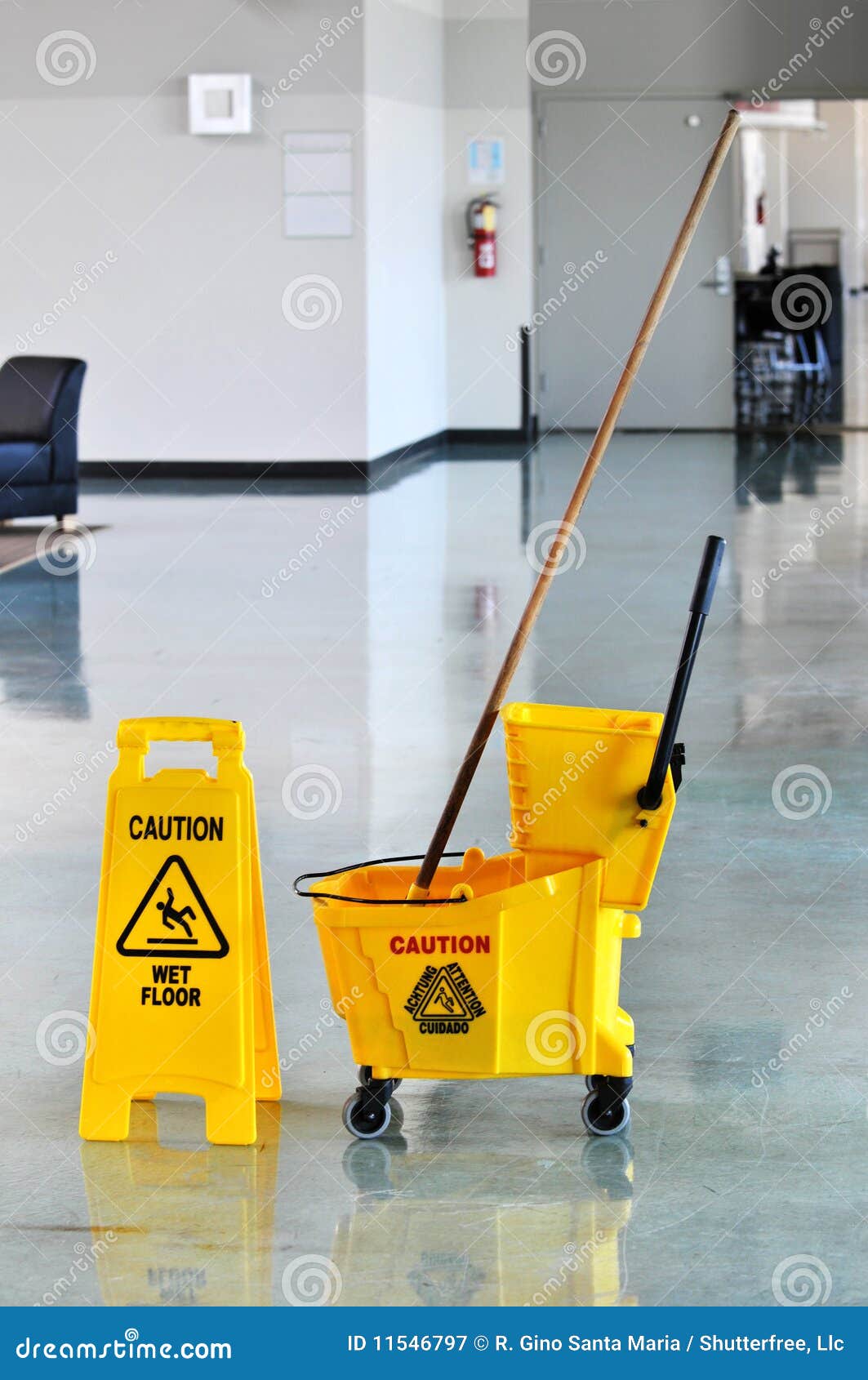 mop and bucket with caution sign