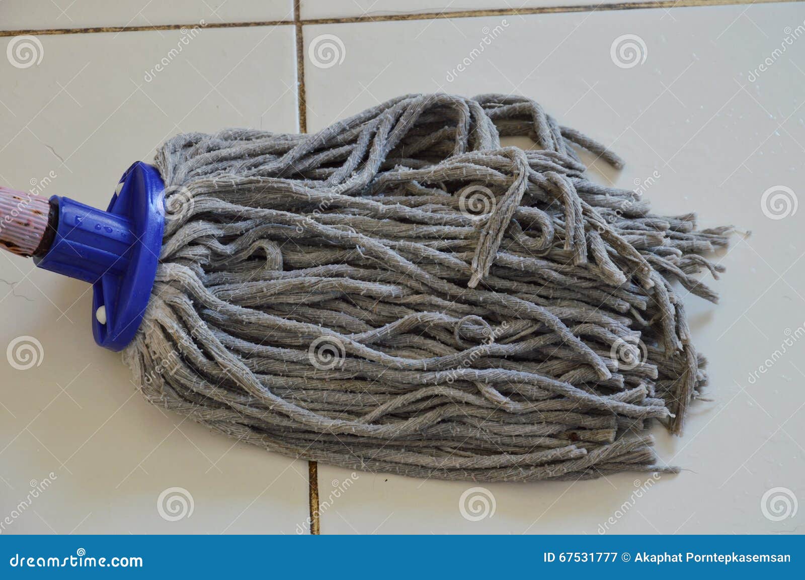 Mop the tile floor in home stock image. Image of equipment 67531777