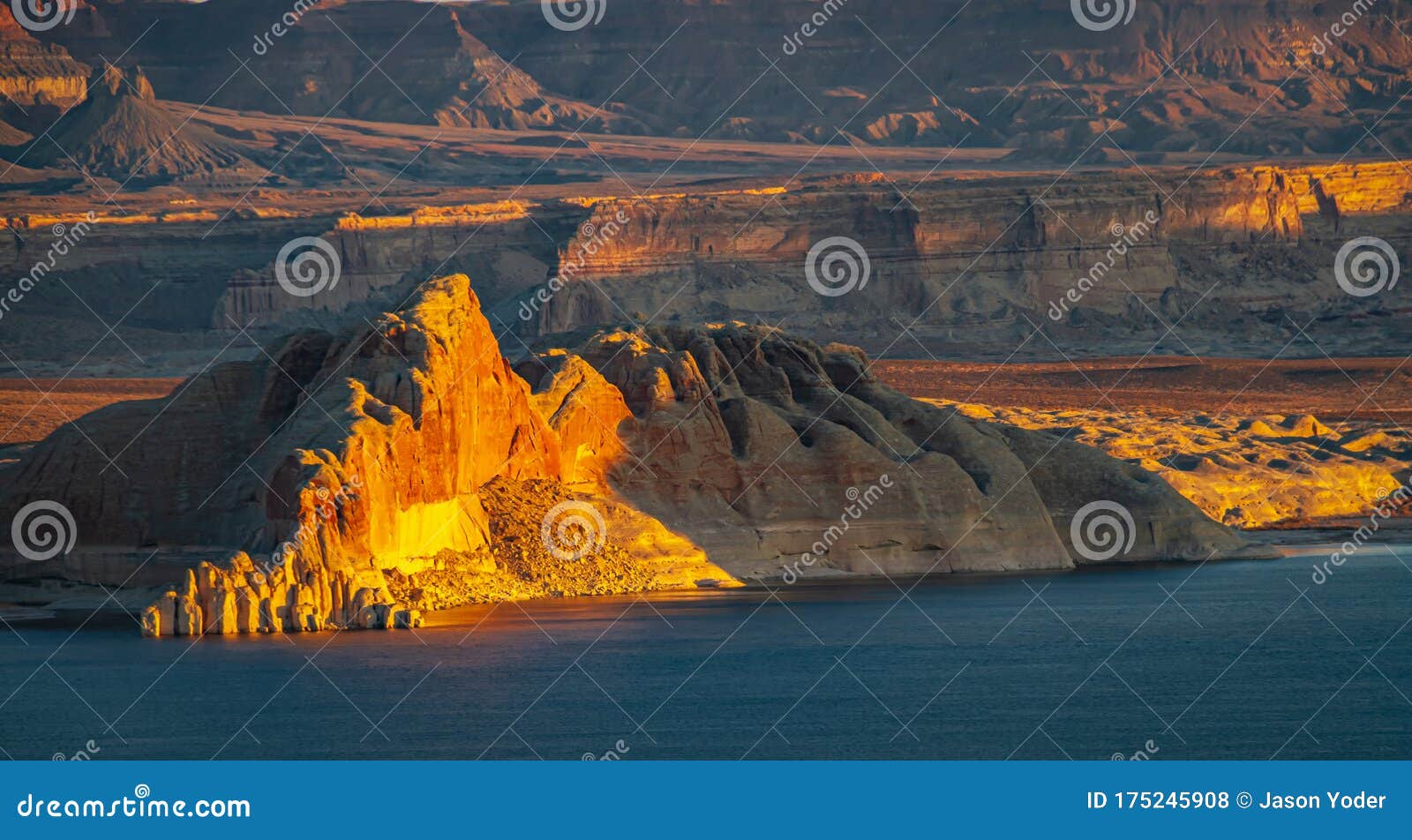 the morning light striking the cliffs of utahÃ¢â¬â¢s grand staircase-escalante national monument with lake powell
