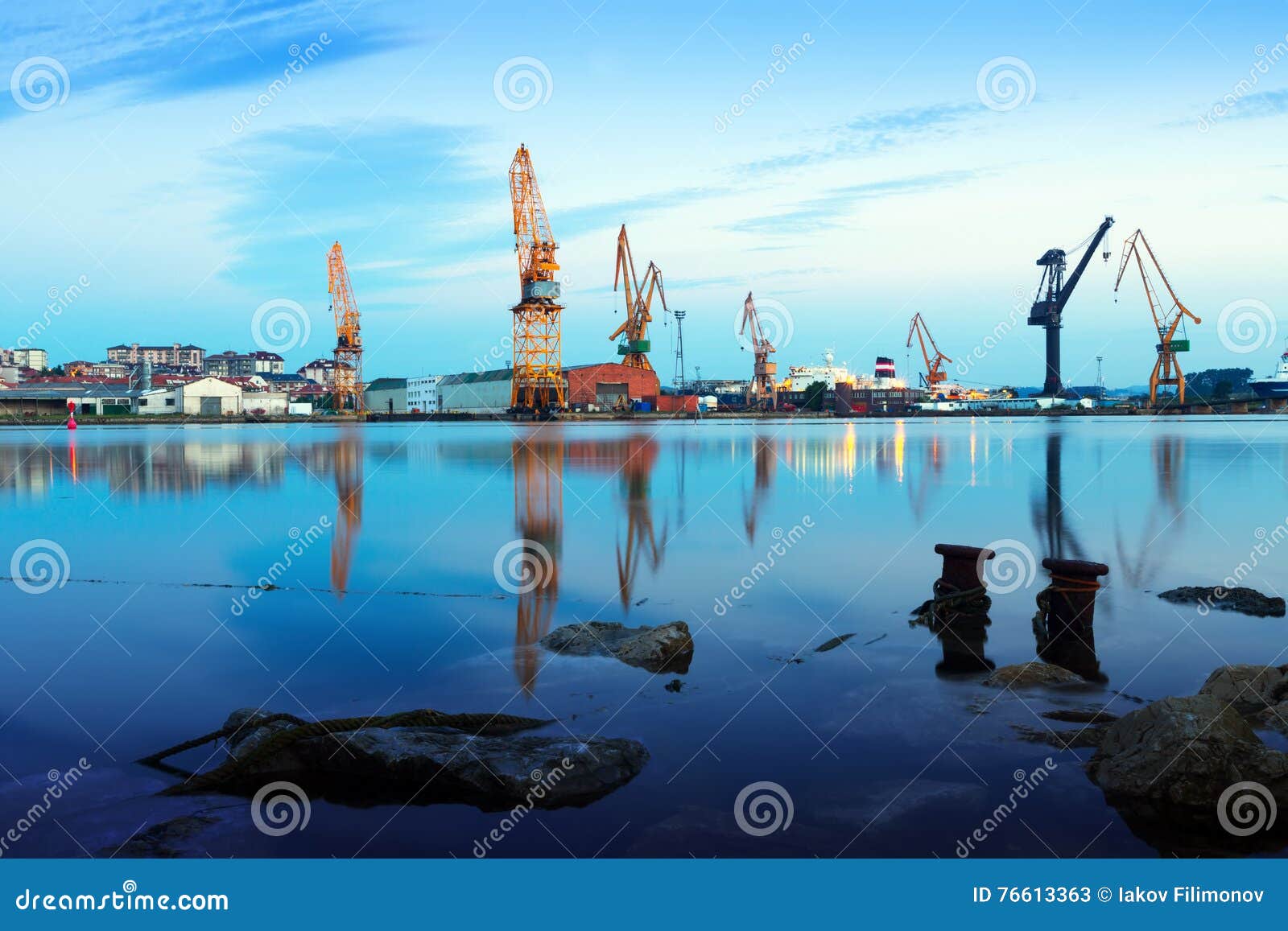 morning view of cranes in cargo seaport