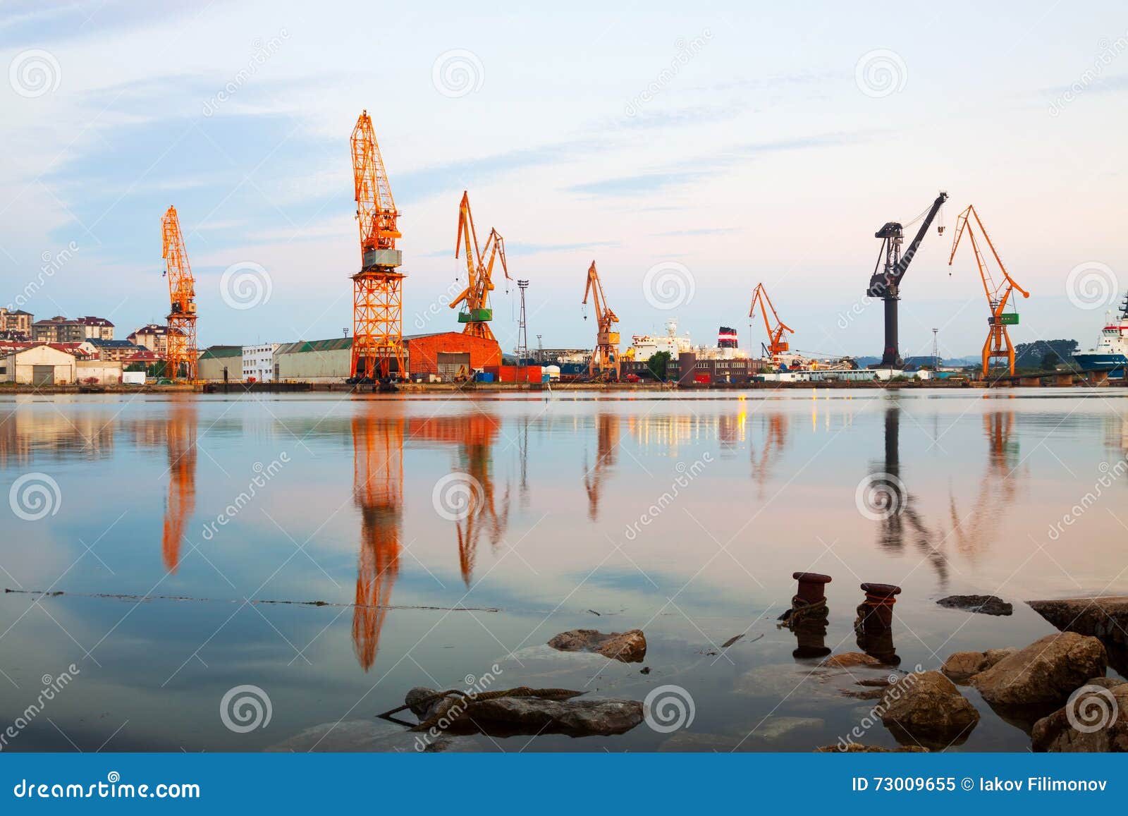 morning view of cranes in seaport