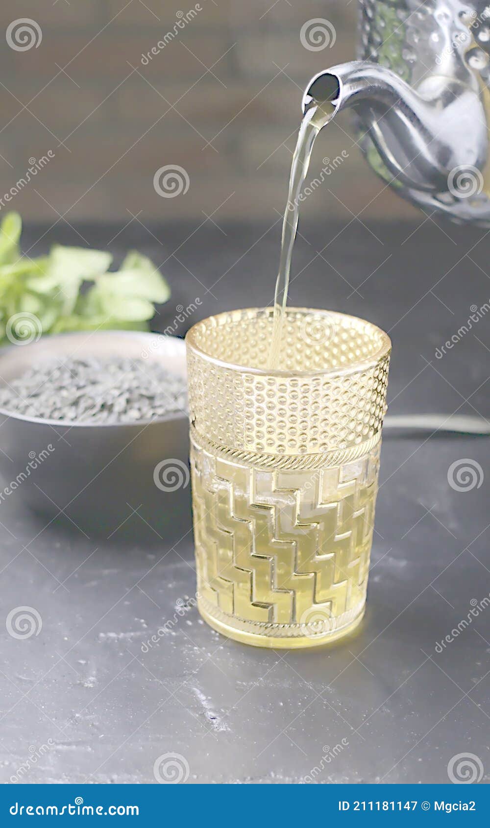 Moroccan Tea with Good Grass Served in Typical Moroccan Glasses, Green