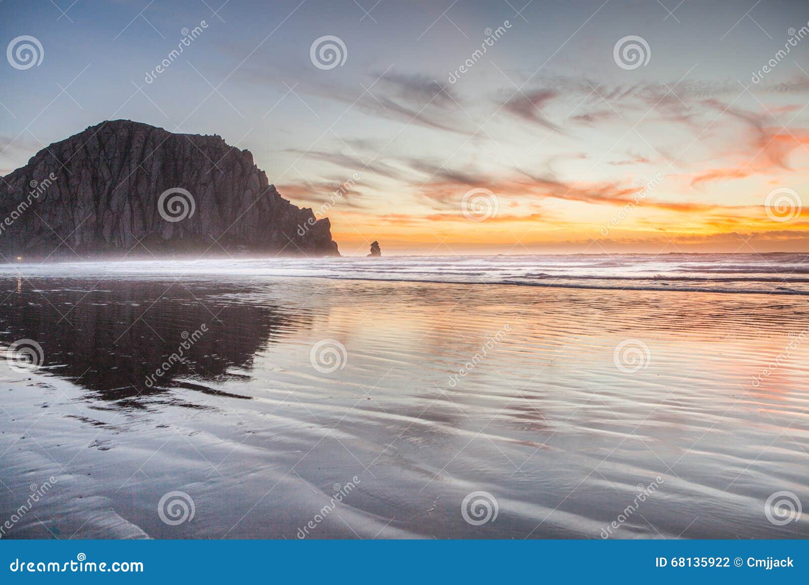 morro bay rock and beach in the sunset evening