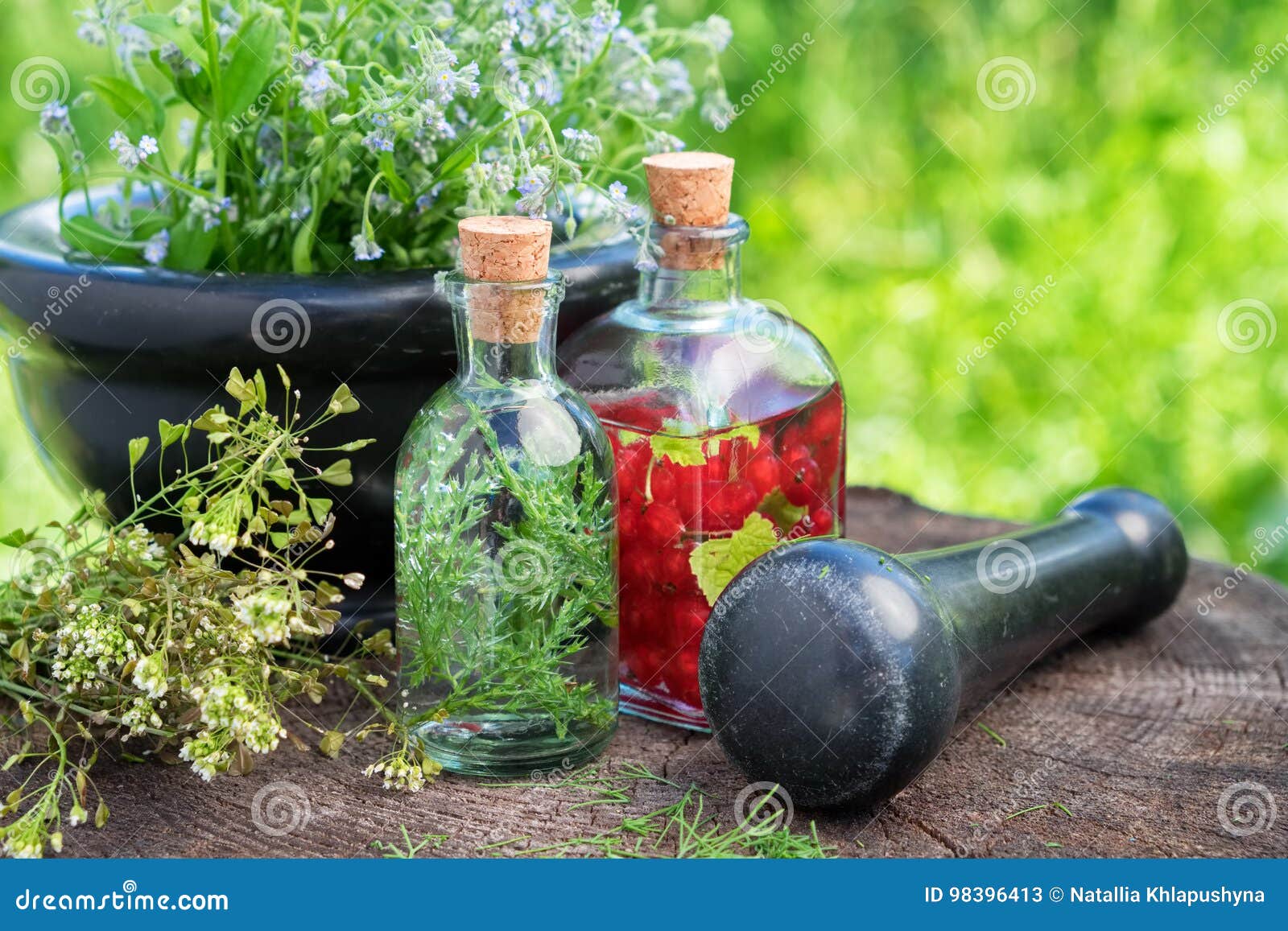 mortar of healing herbs, herbal tincture, healthy infusion and medicinal plants.