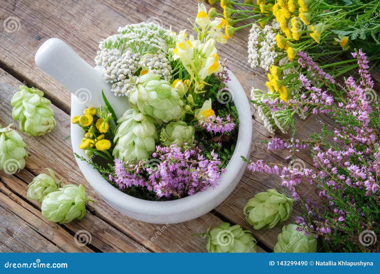 mortar of medicinal herbs, healthy plants on wooden table. top view. herbal medicine.