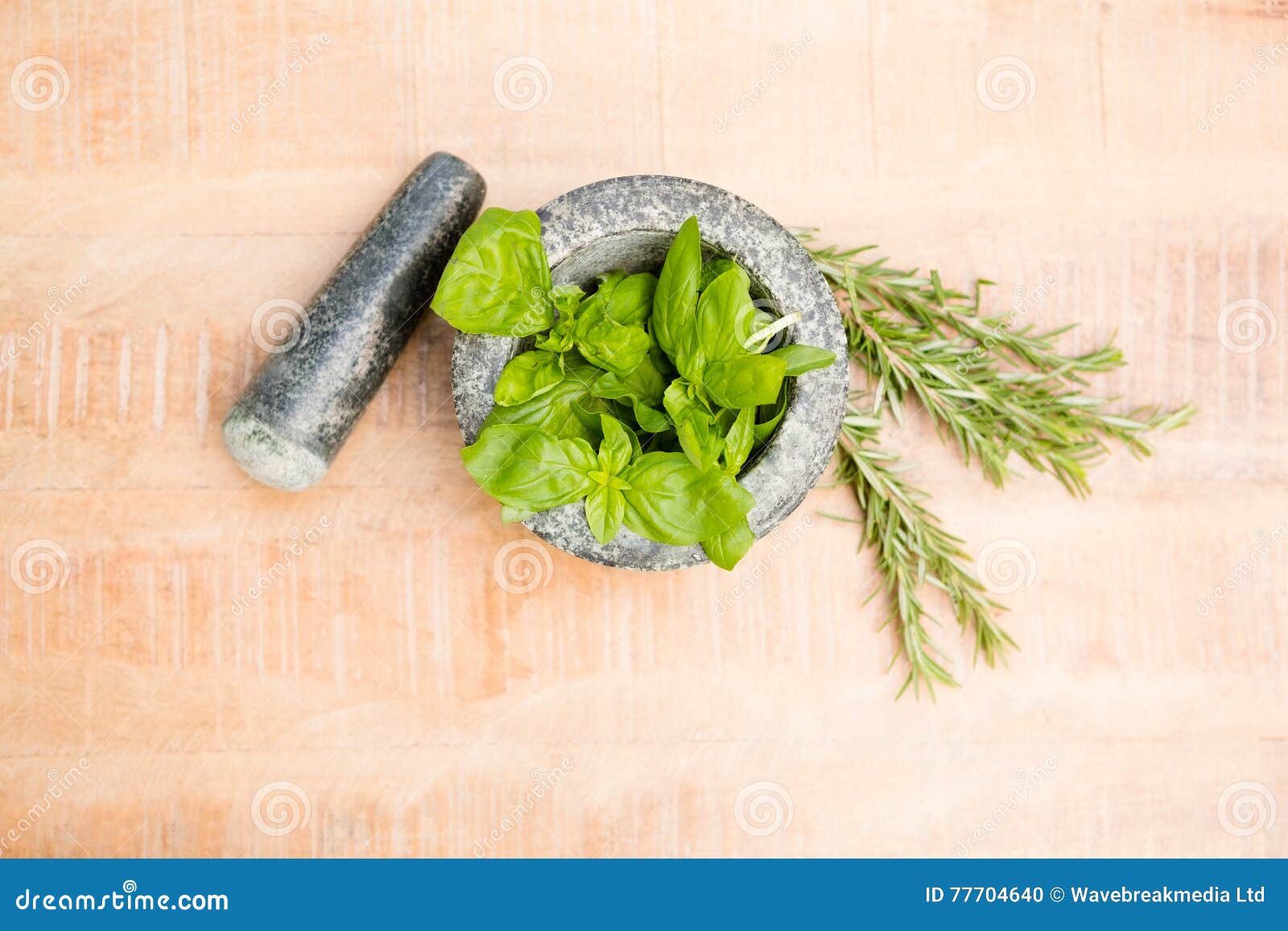 Mortar and Pestle with Basil and Rosemary on Table Stock Photo Image