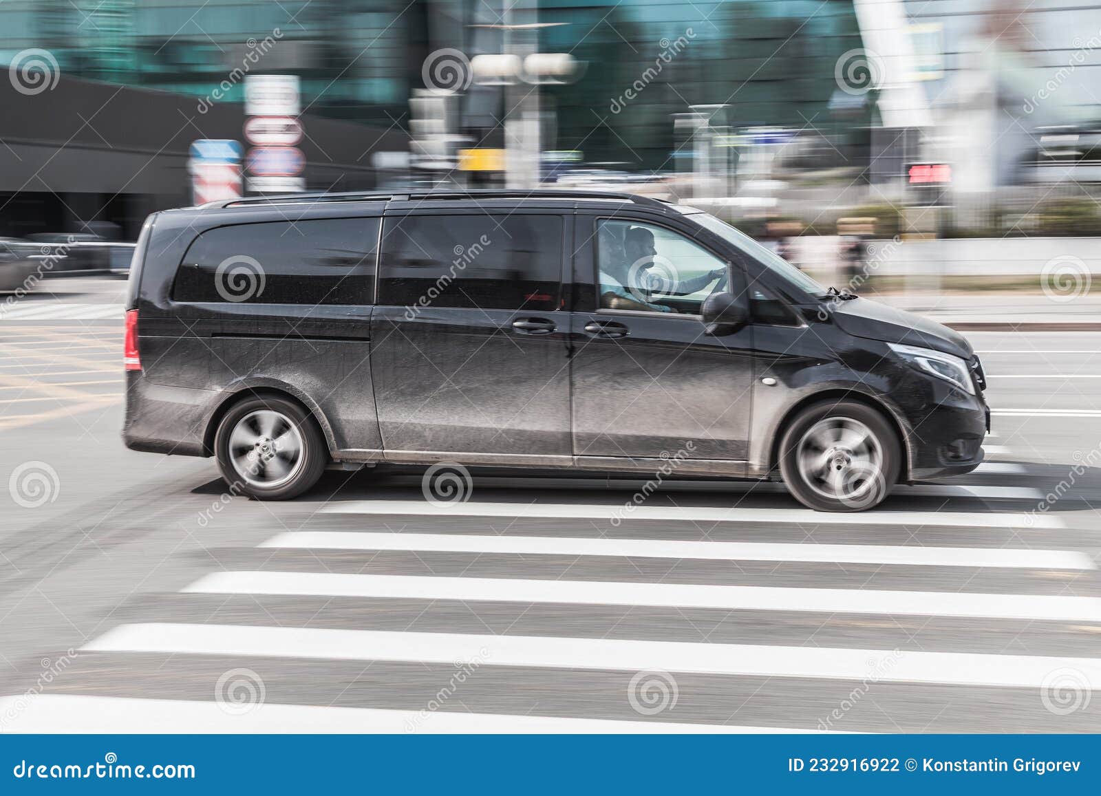 Black passenger van Mercedes Benz W447 Viano in the city street in