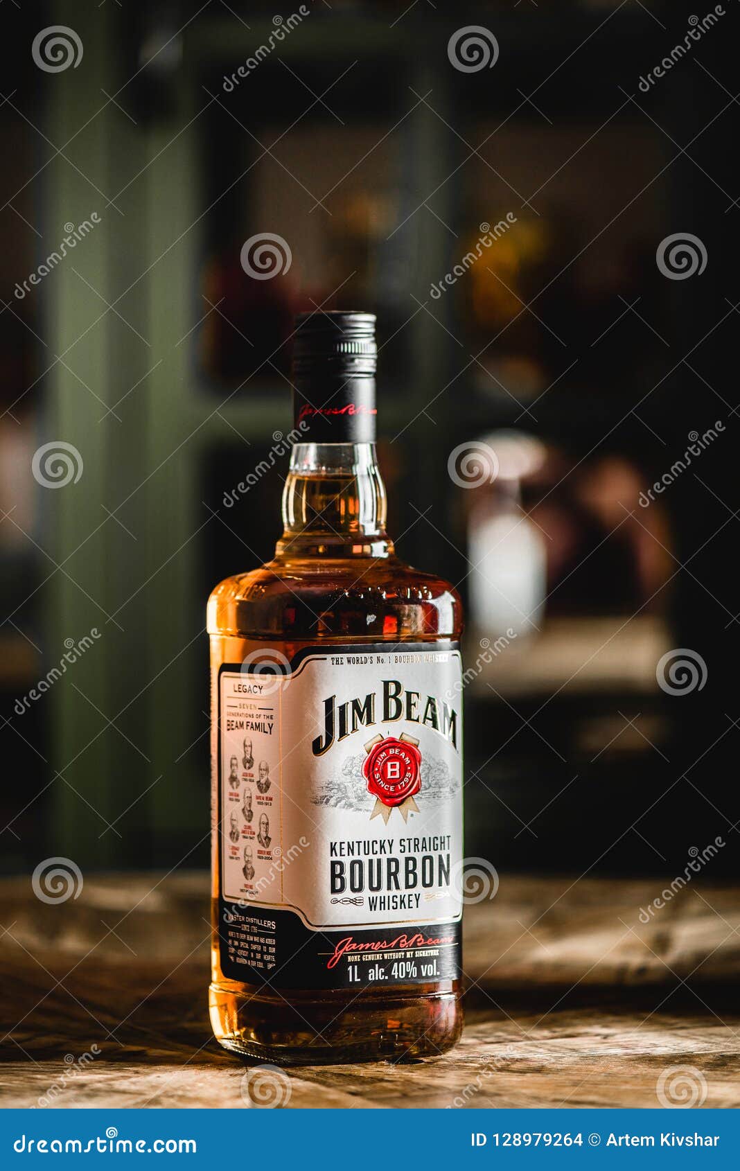 jim beam bourbon bottle on wooden table in dark bar editorial stock