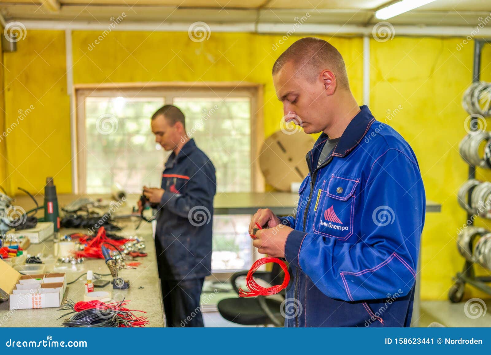 Small Cable Installation Plant. Electric Workers Knit a Cable