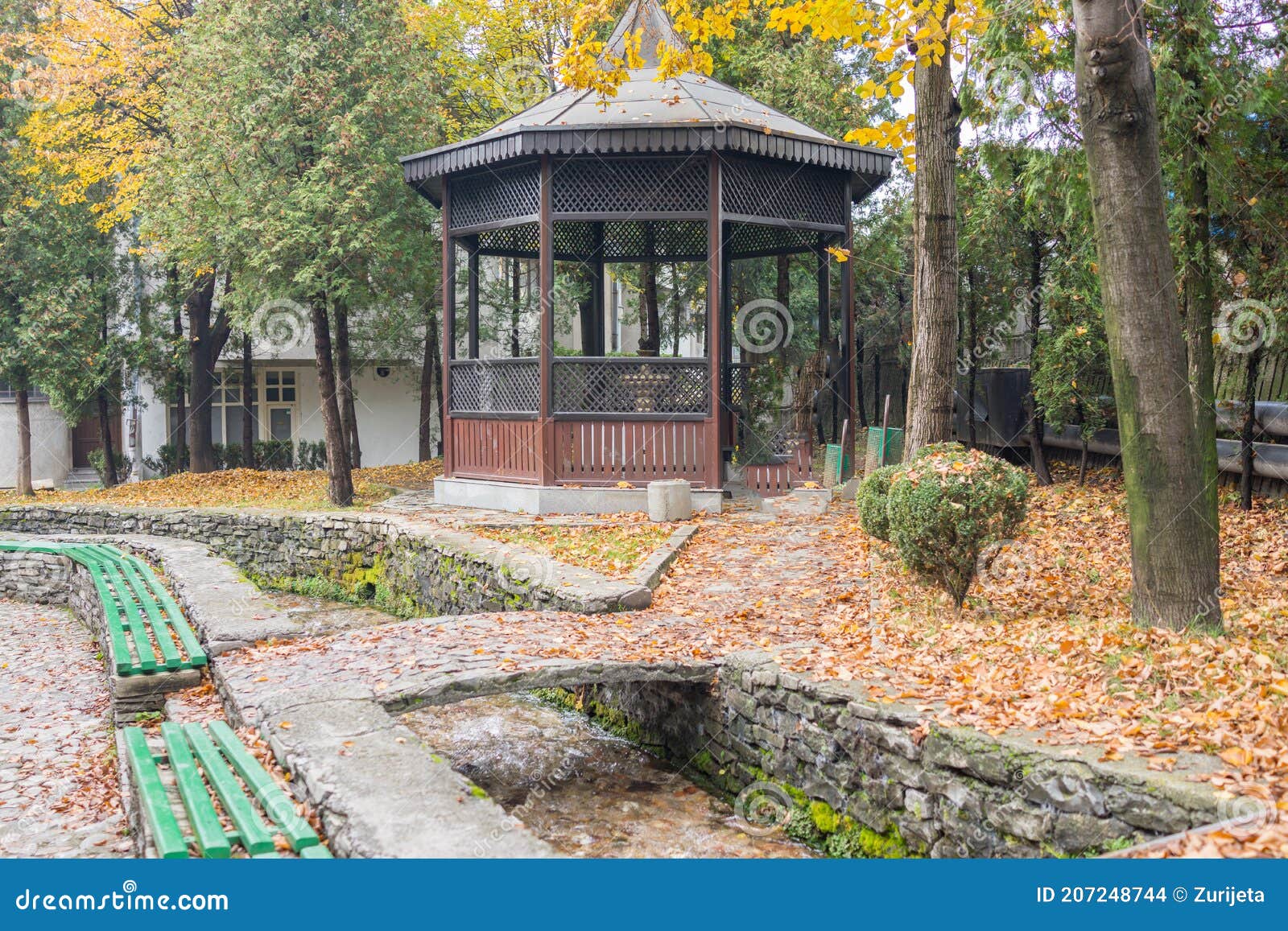 mosque with fountain in front, with large glass building. high quality photo