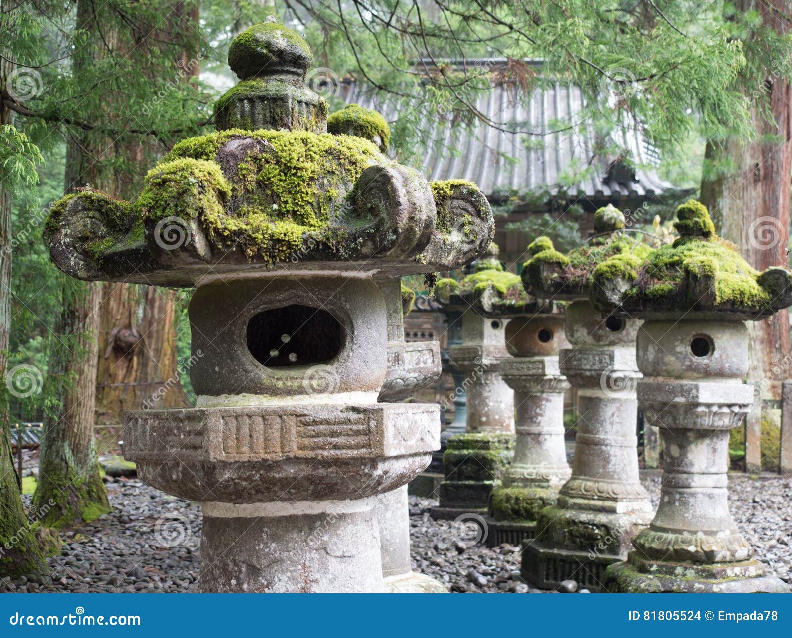 Moss Covered Stone Statues in a Pebble Garden Stock Photo Image of