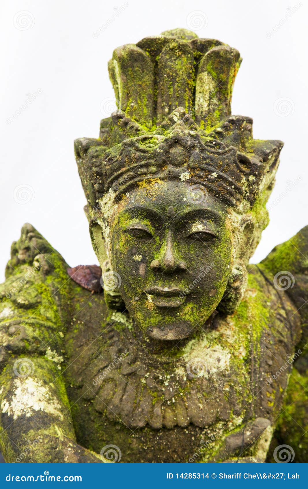 mossy stone statue at pura ulun danu batur, bali