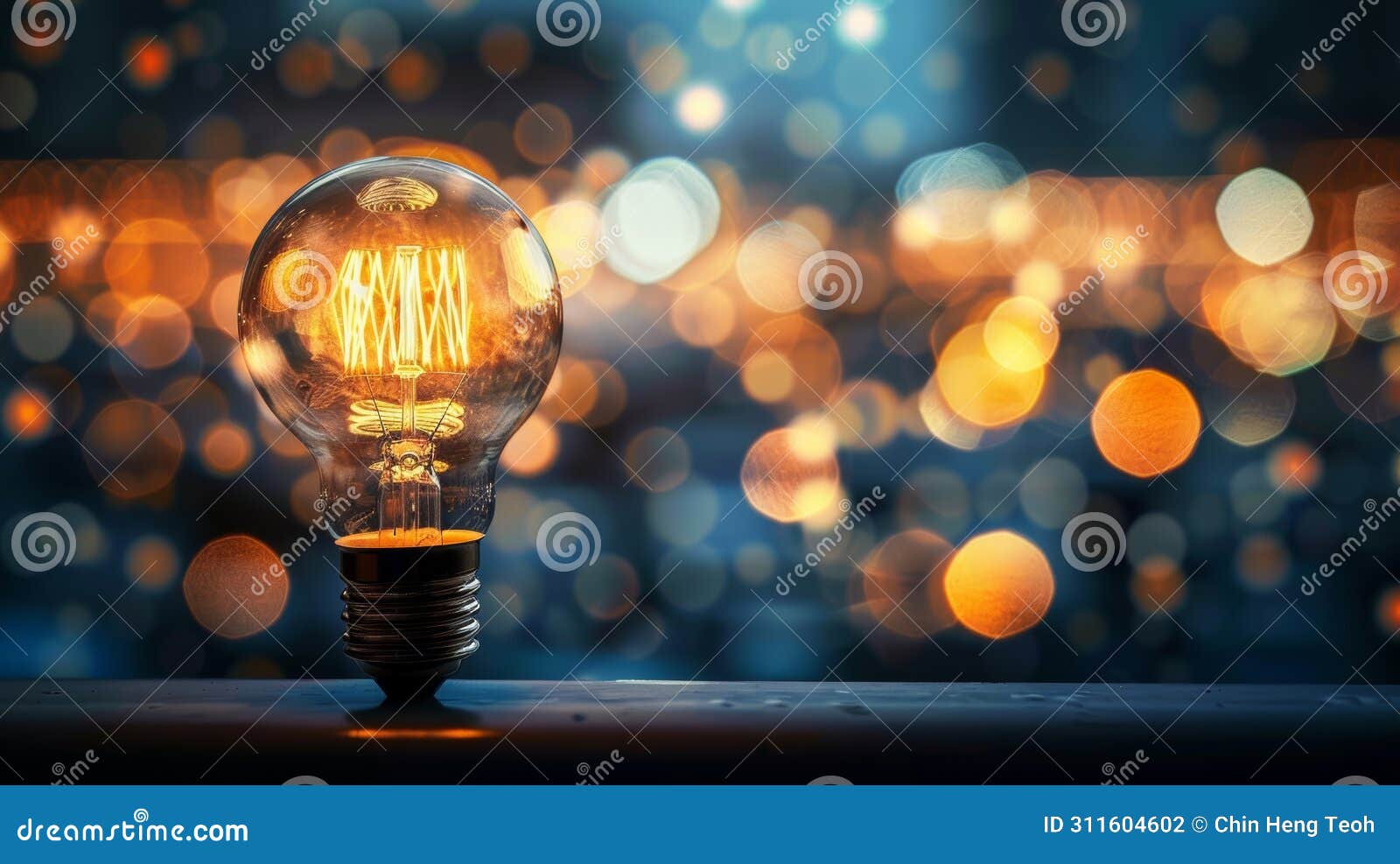 incandescent light bulb on bokeh background, energy saving concept