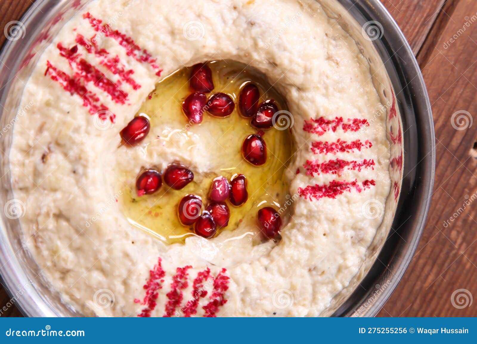 motabal or mutabal and baba ghanoush with pomegranate seeds served in dish  on background top of arabic food cold mezza