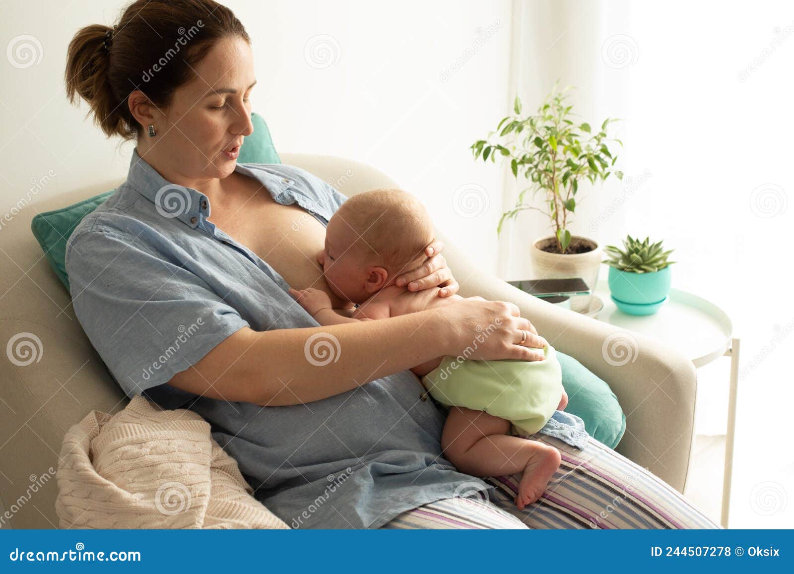 mothed and baby, breastfeeding in laid back position