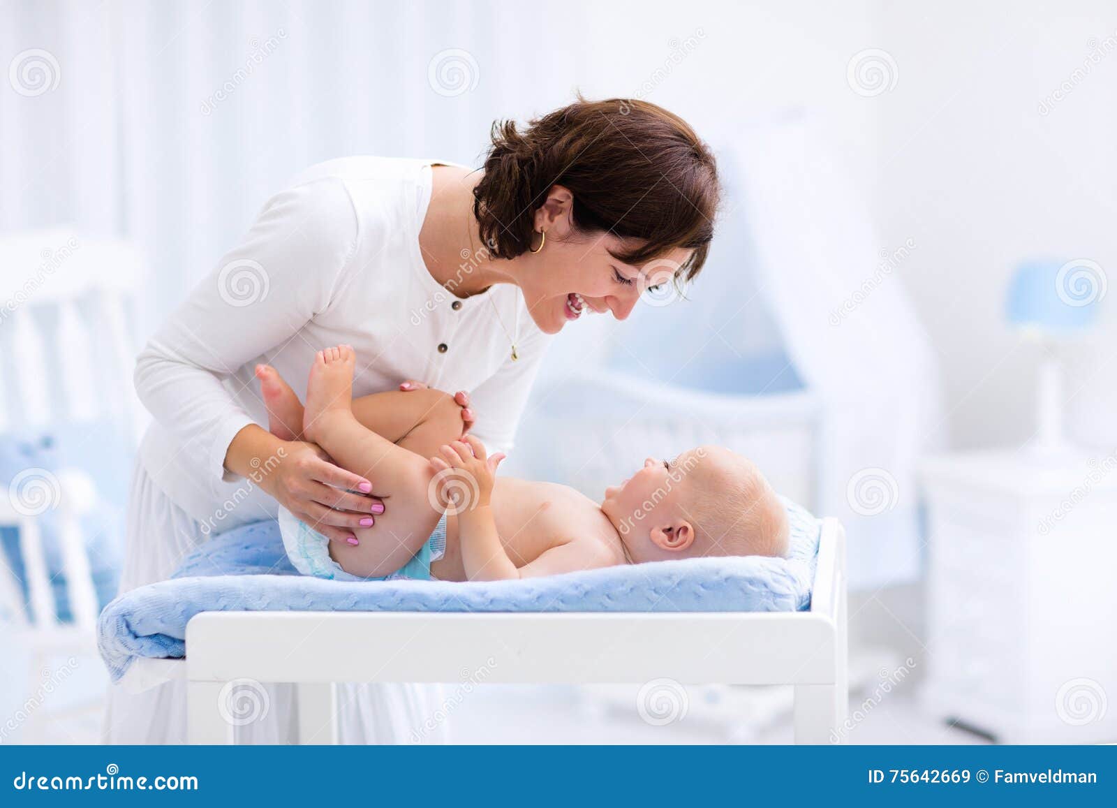Mother Changing Diaper To Baby Boy Stock Photography ...