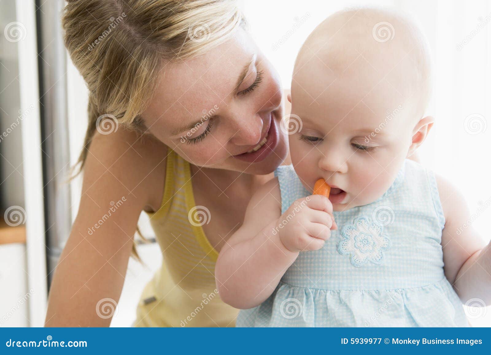 Mother and Baby Eating Carrot Stock Image Image of camera, cuddling