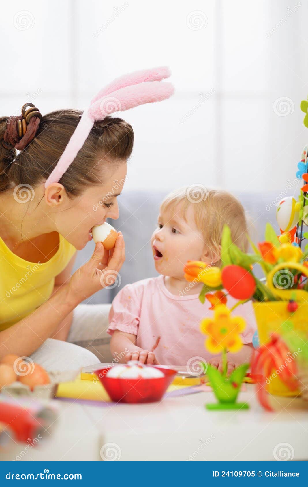 Mother And Baby Eating Easter Egg Royalty Free Stock Photo - Image