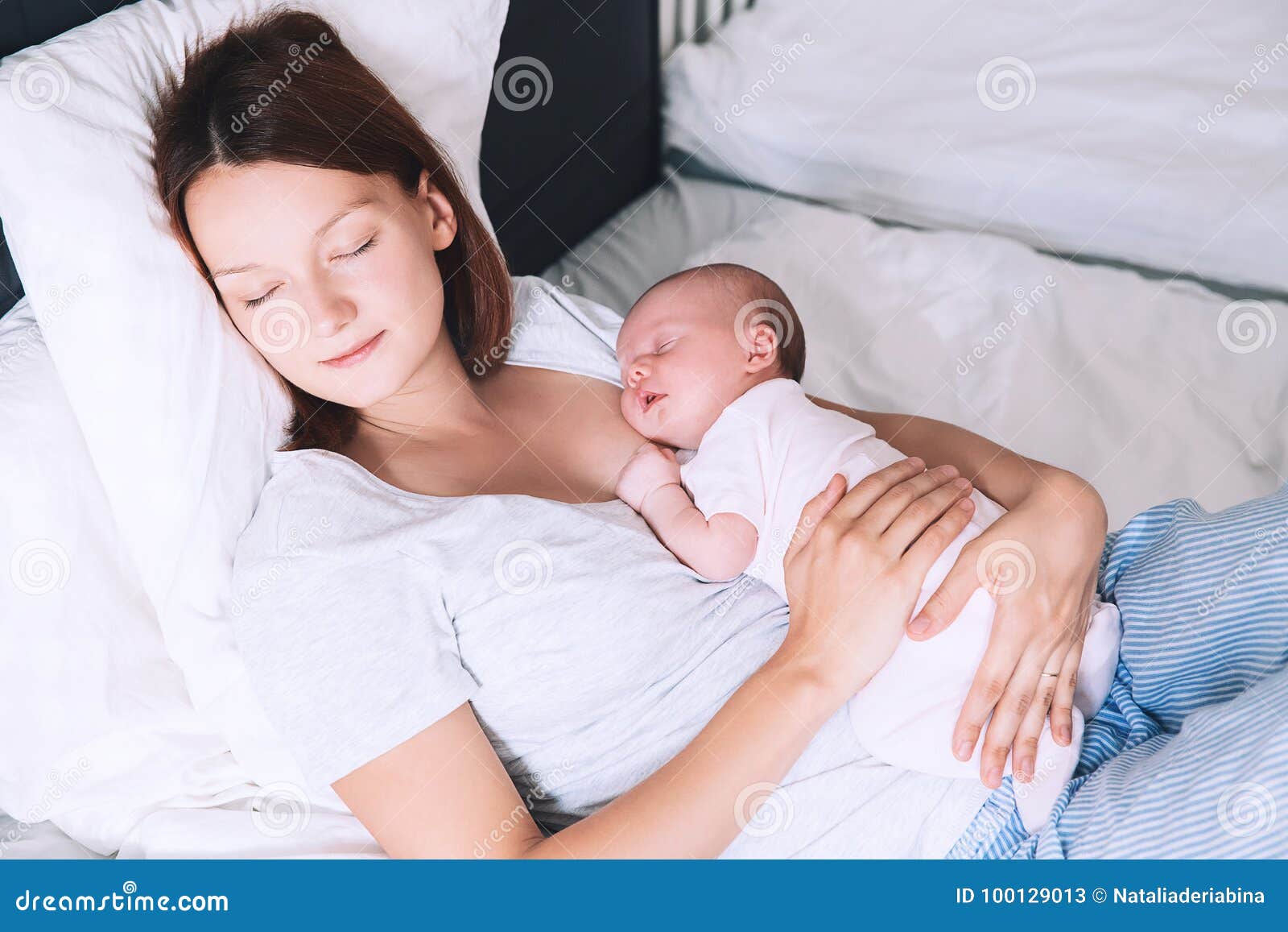 beautiful mom feeding baby