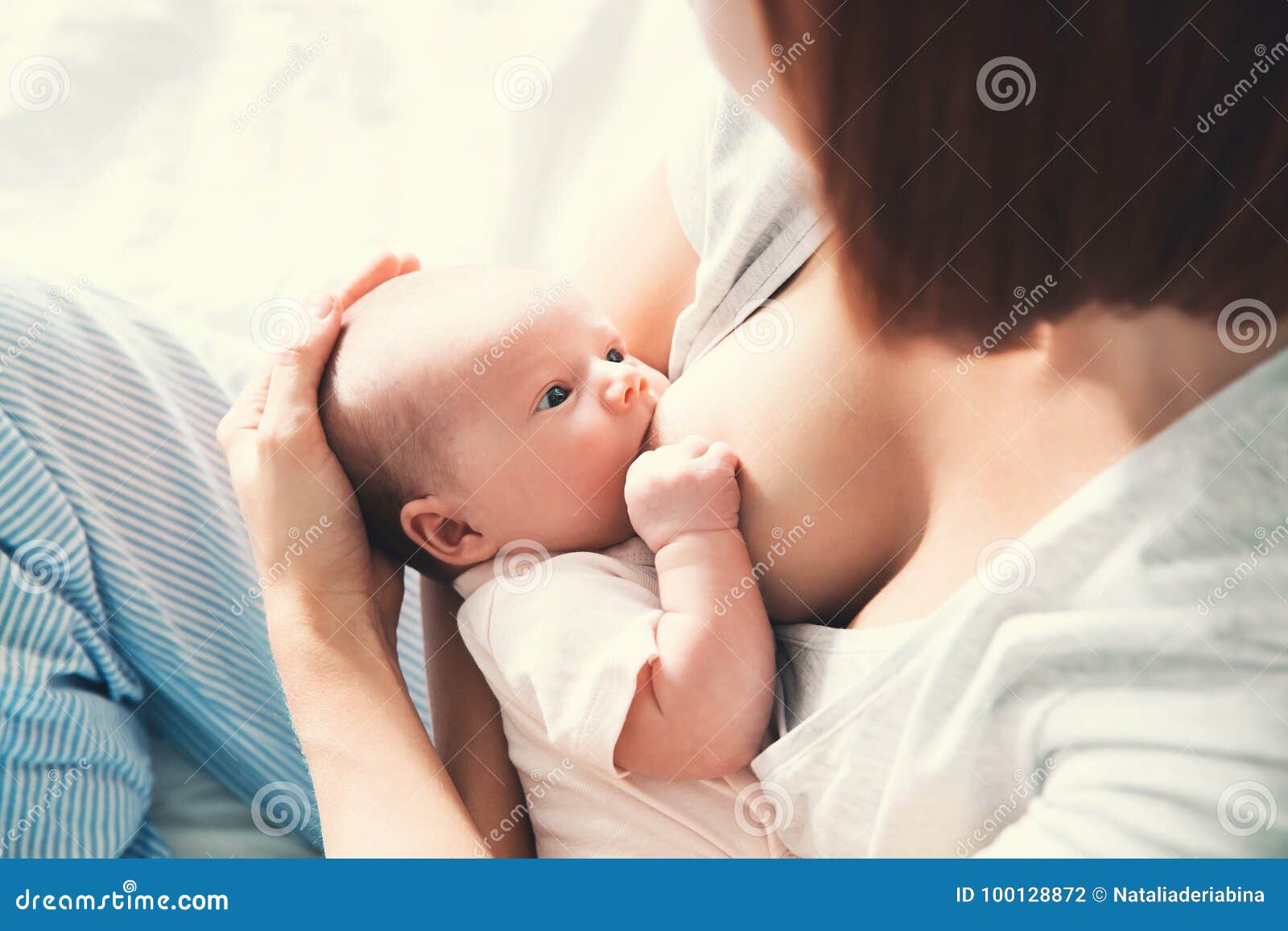 beautiful mom feeding baby