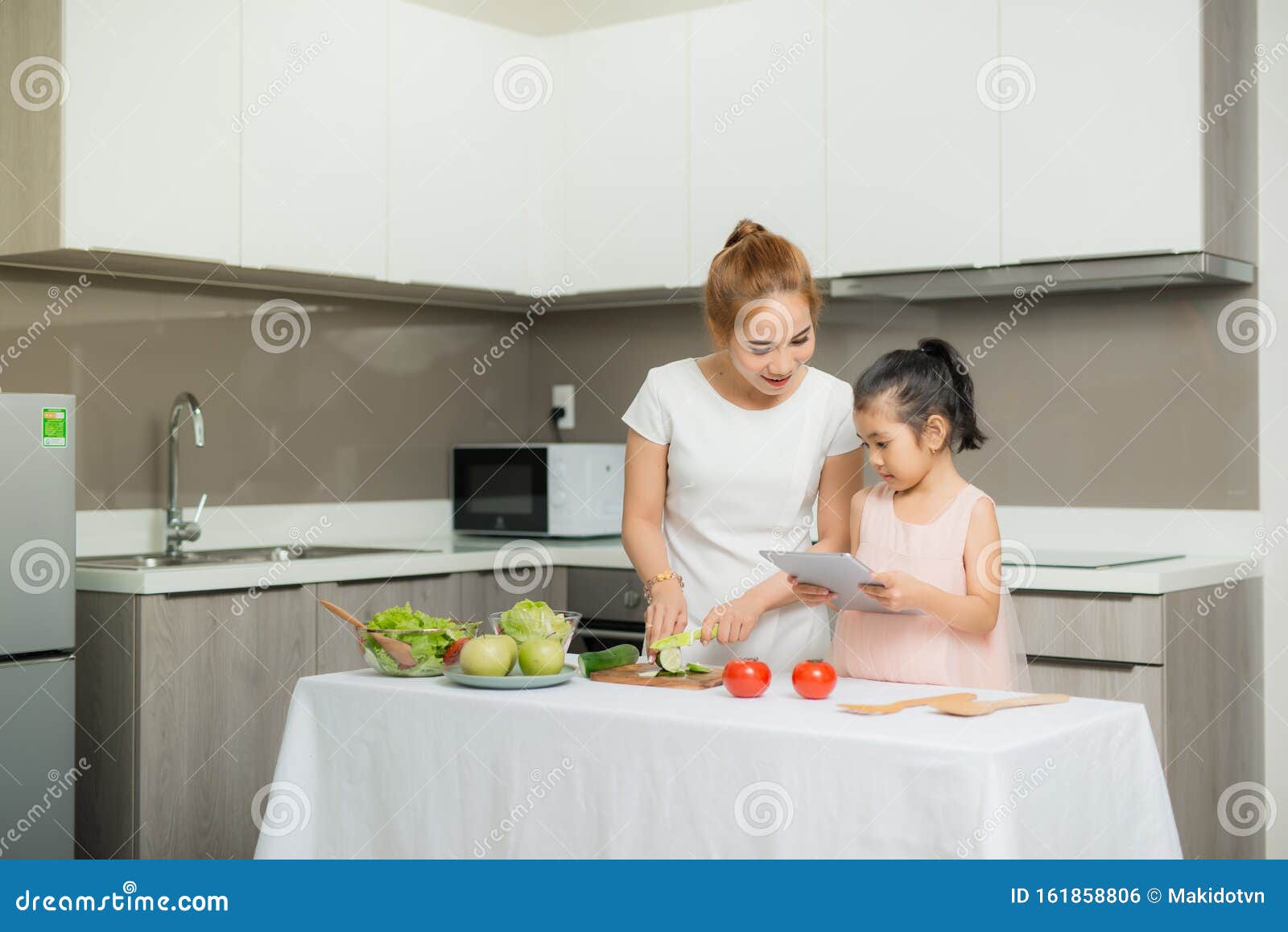 mother and child and computer use, invented a food menu