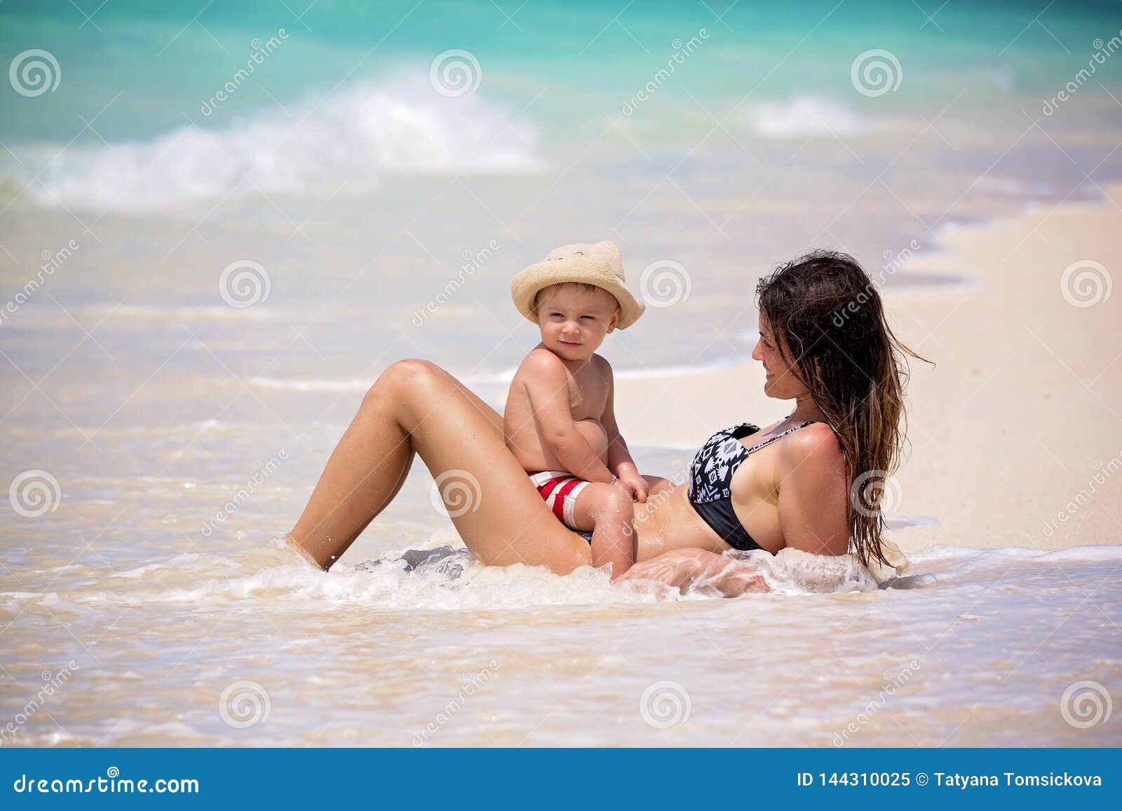 Mother and Child Playing at Tropical Beach. Family Sea Summer