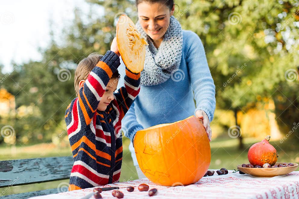 mother-and-child-prepare-pumpkin-for-halloween-stock-photo-image-of
