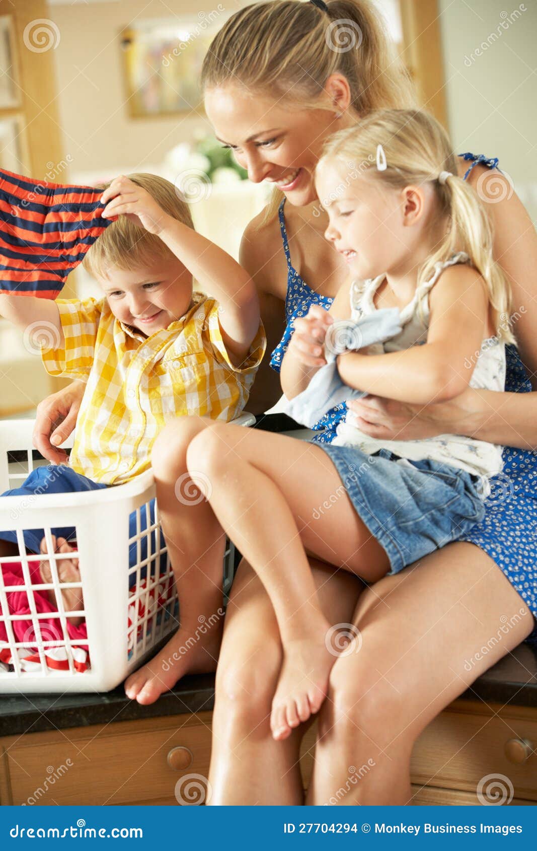 mother and children sorting laundry