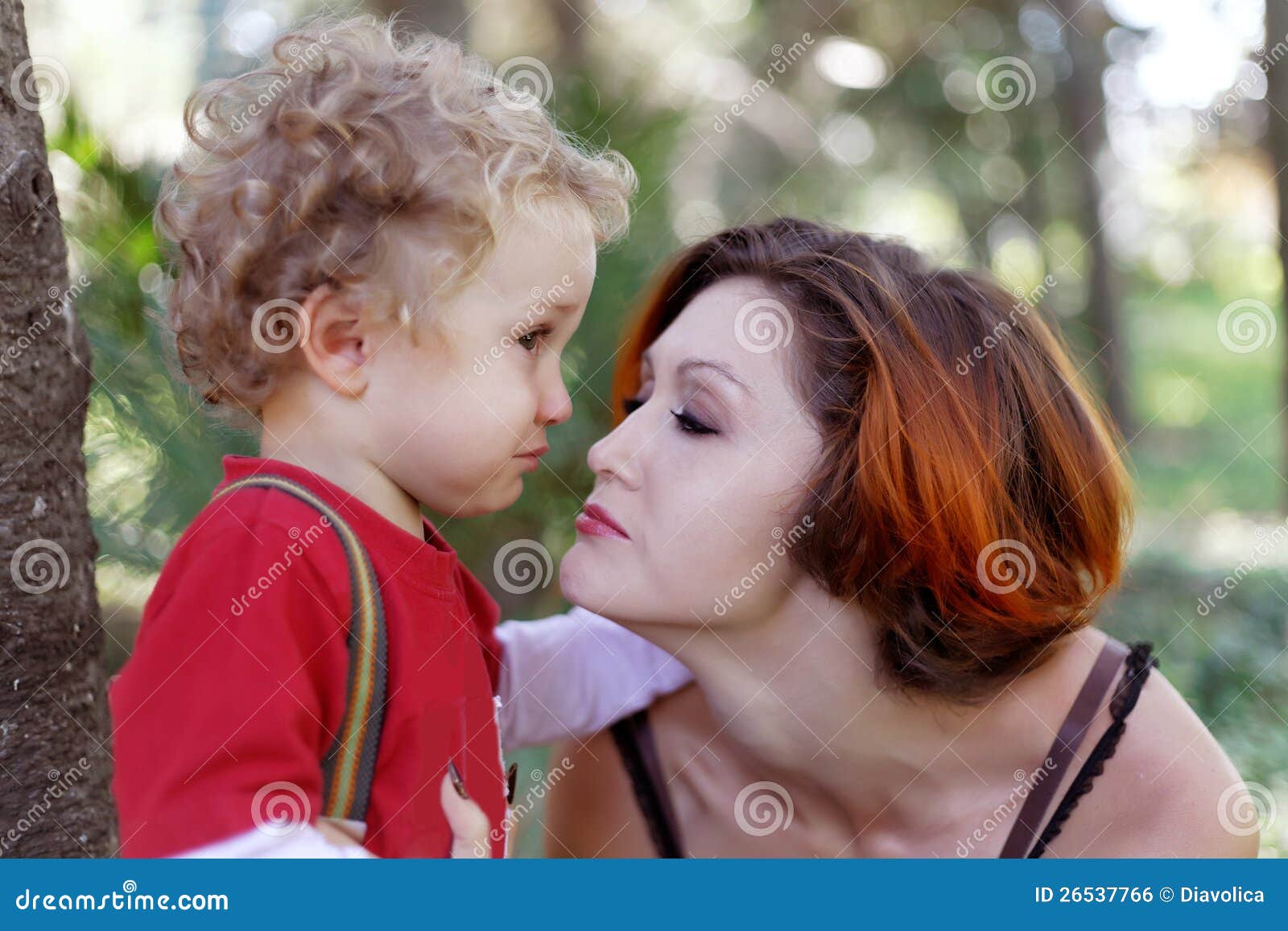 Mother comforts her son stock photo. Image of modern 26537766