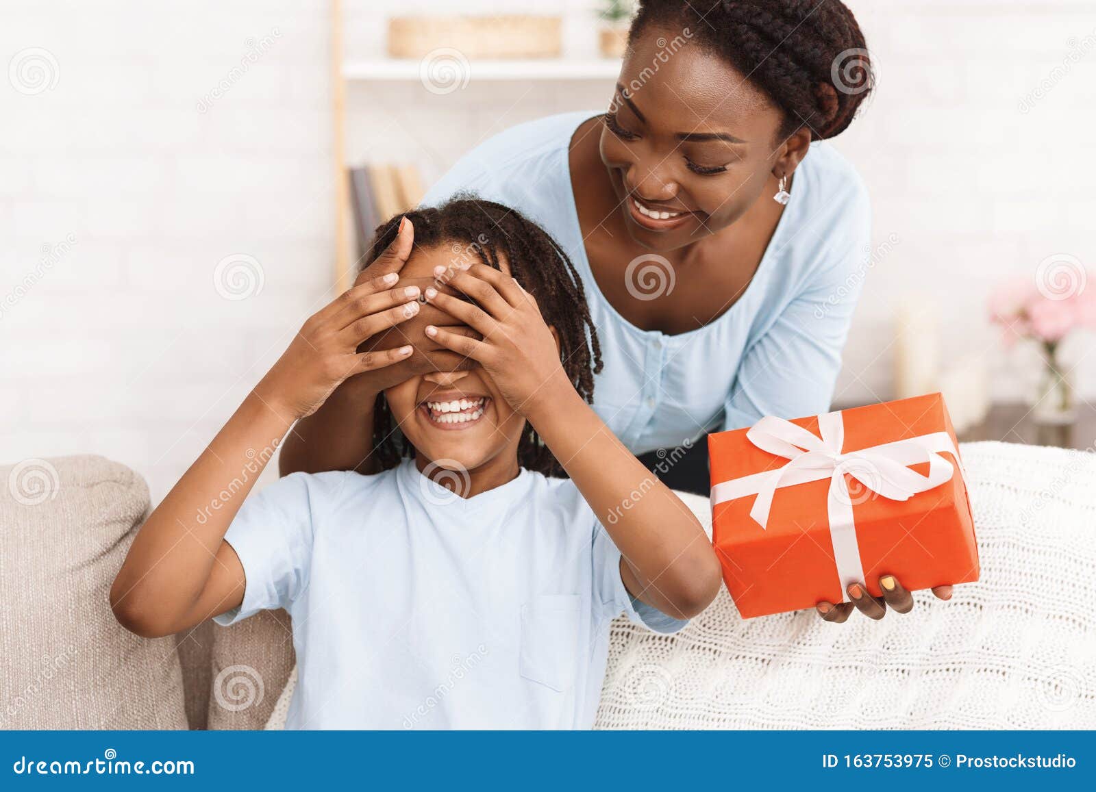 Daughter Gives Her Mother Flowers Gifts She Makes Her Surprise Stock Photo  by ©vadimphoto1@gmail.com 177813608