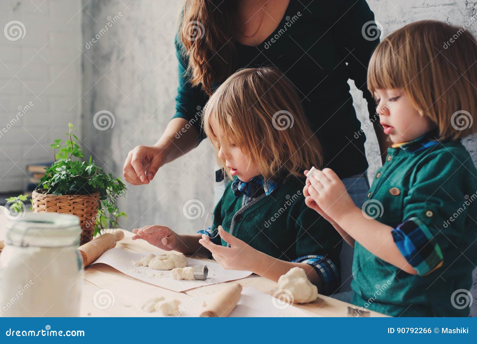 Mother Cooking With Kids In Kitchen. Toddler Siblings Baking Together