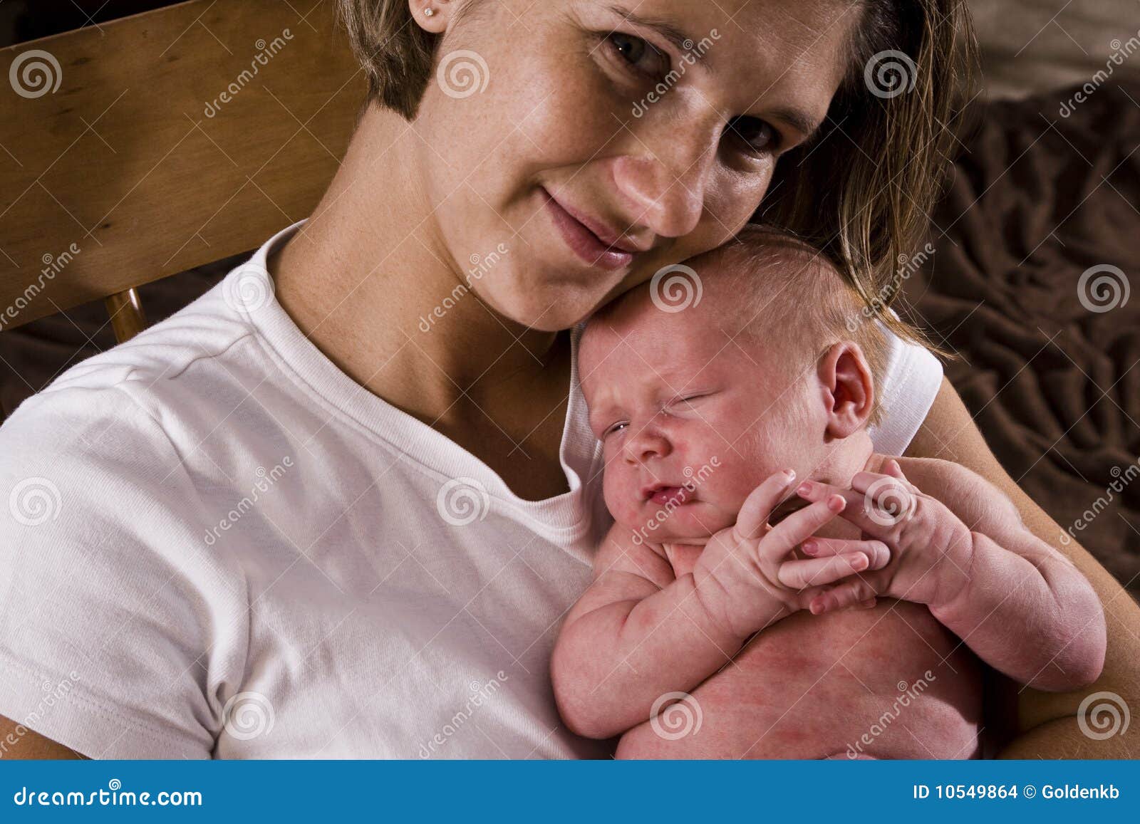 Mother cradling newborn stock photo. Image of affection 10549864